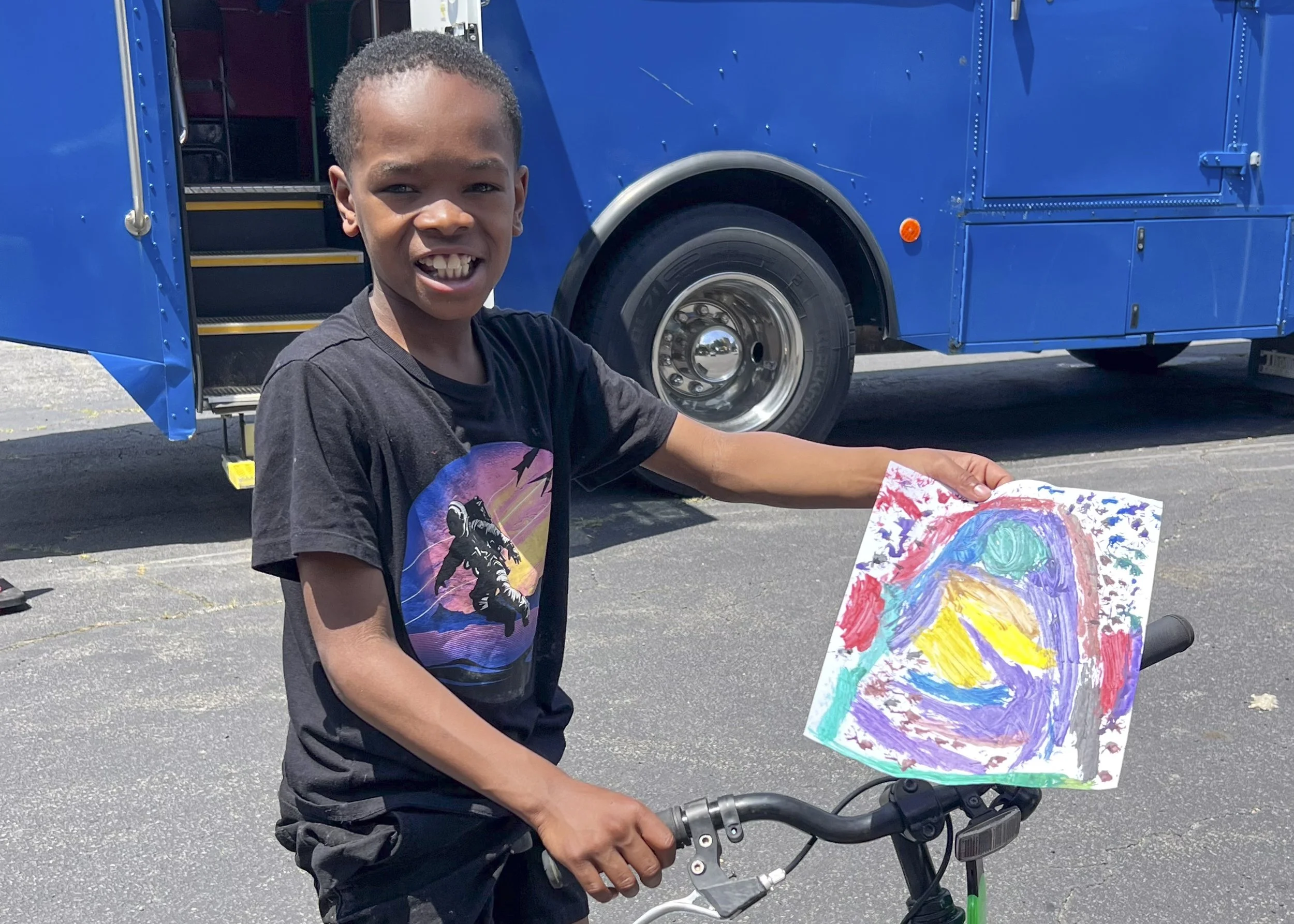 A Young Artist Shows Off His Artwork