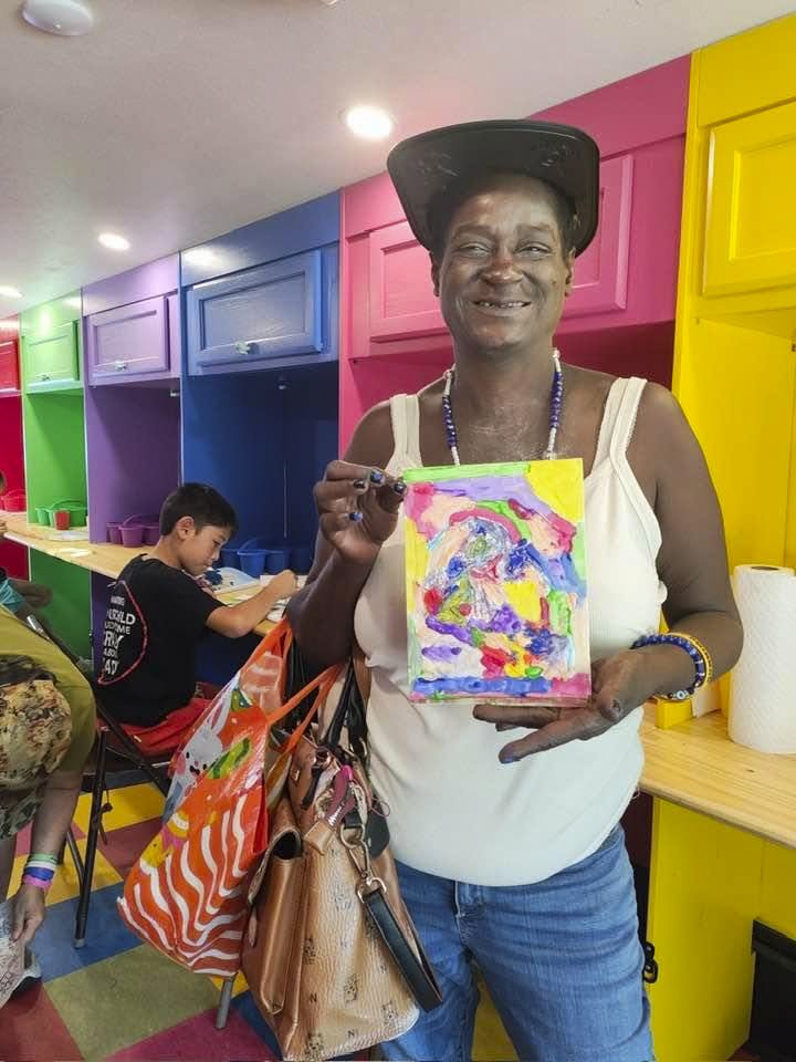 TCAT Art Cart Participant with Her Painting