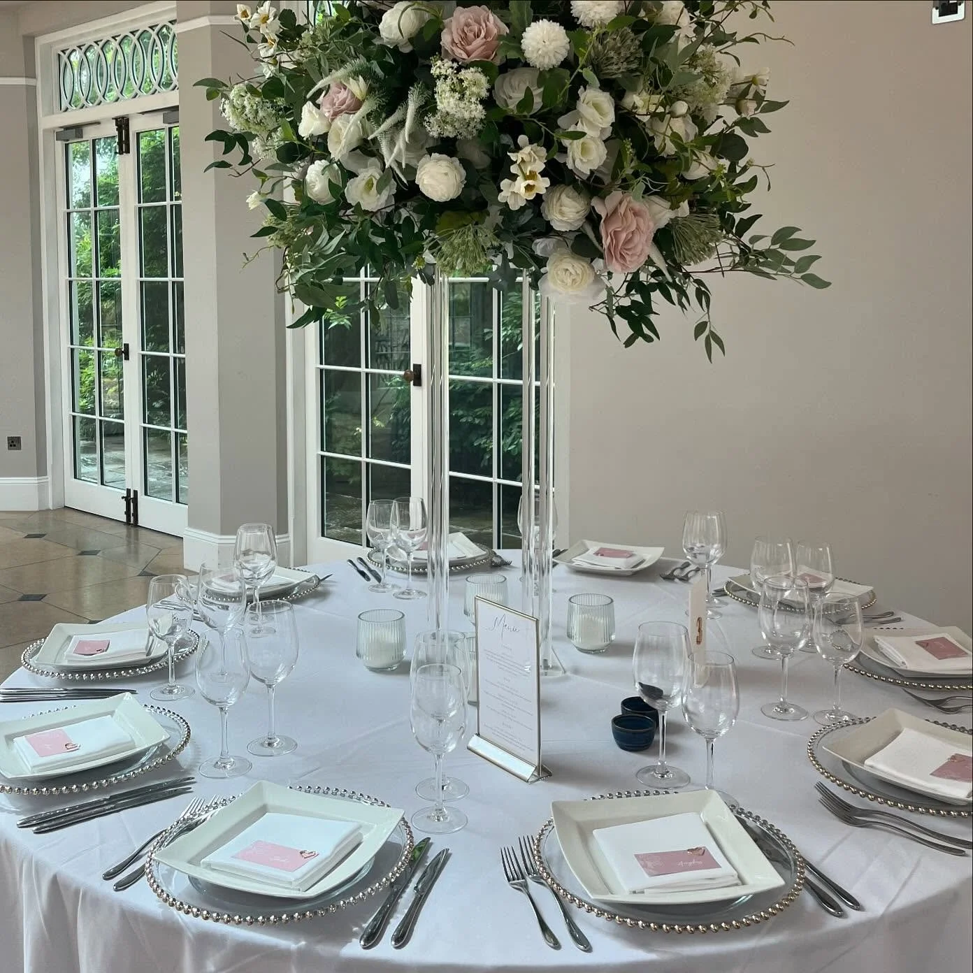 An absolutely beautiful set up yesterday @rockbeare_manor_ with our special friend @all_floral. Styling included chair drapes with fresh eucalyptus, gold beaded charger plates and was teamed with the beautiful centrepieces by the lovely Laura.