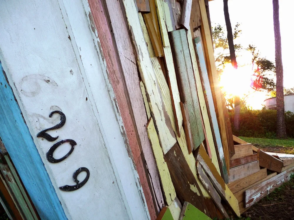 The wood was recovered and documented from 29 homes destroyed after Hurricane Katrina. The original color of each home has been preserved to celebrate the vibrancy of New Orleans neighborhods.