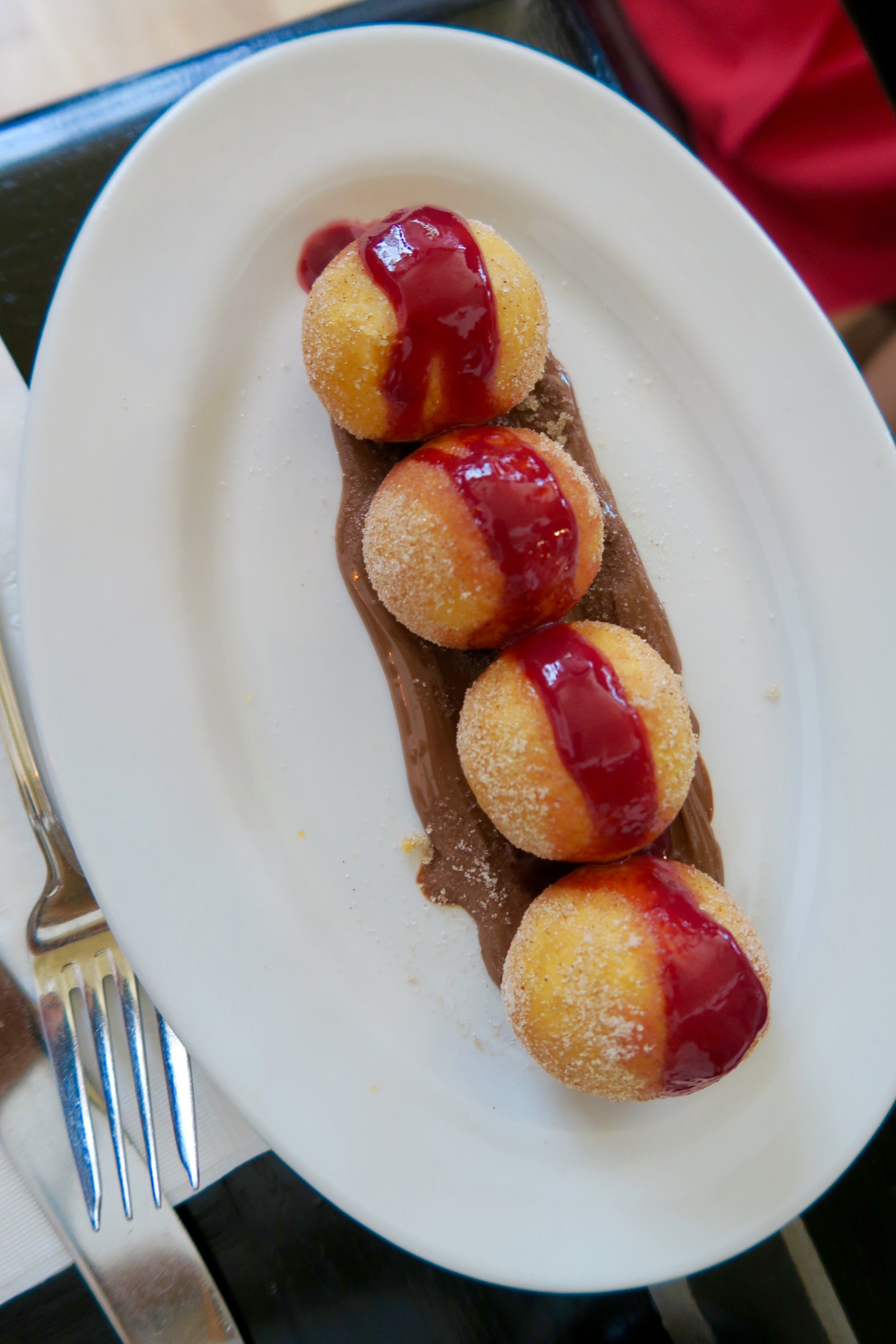 Beignets: nutella and raspberry sauce