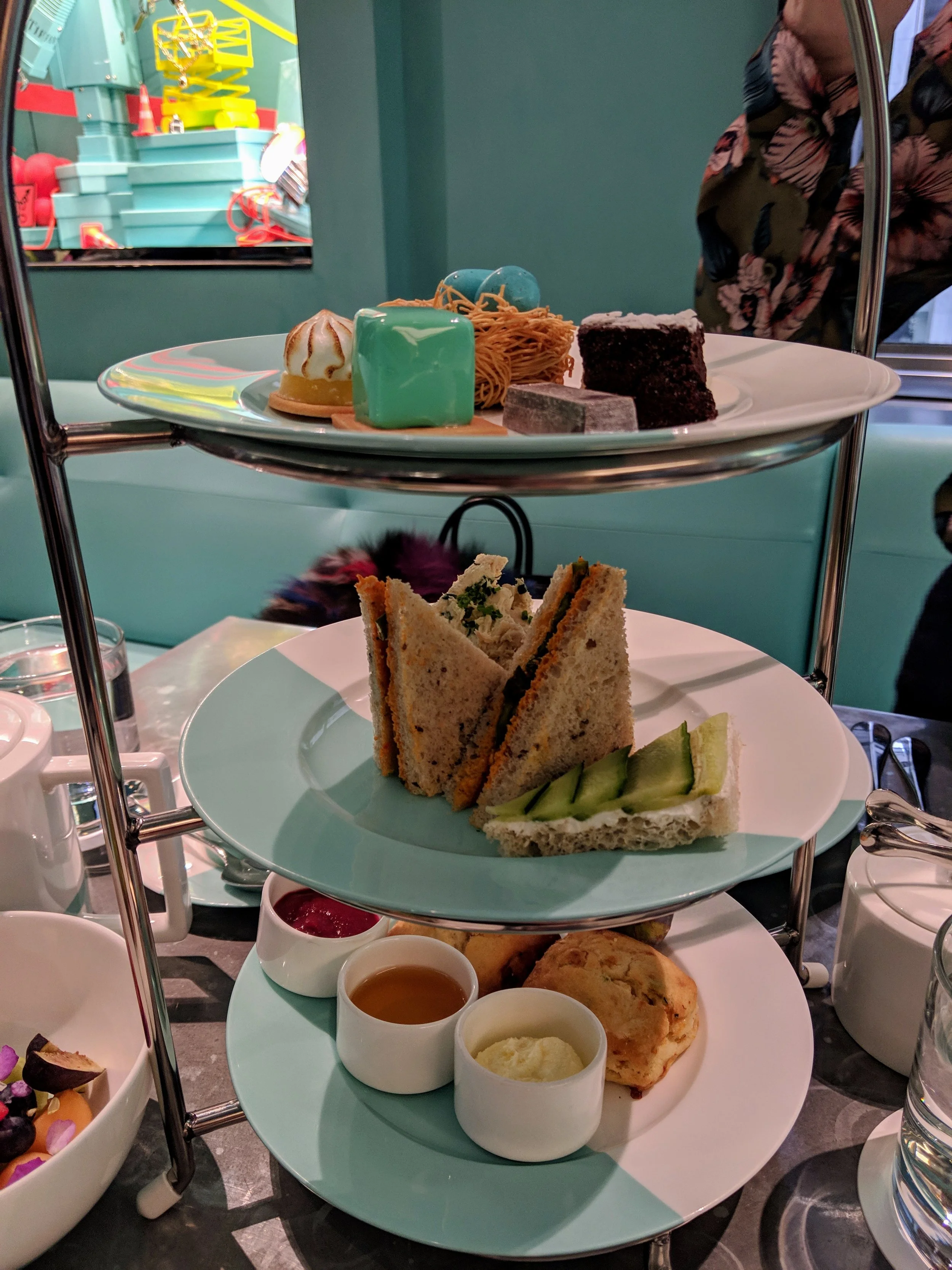 TIFFANY TEA Cucumber Goat Cheese, Romesco & Asparagus sandwiches, Sweet & Savory Scones with clotted cream, winter fruit preserves, and honey butter