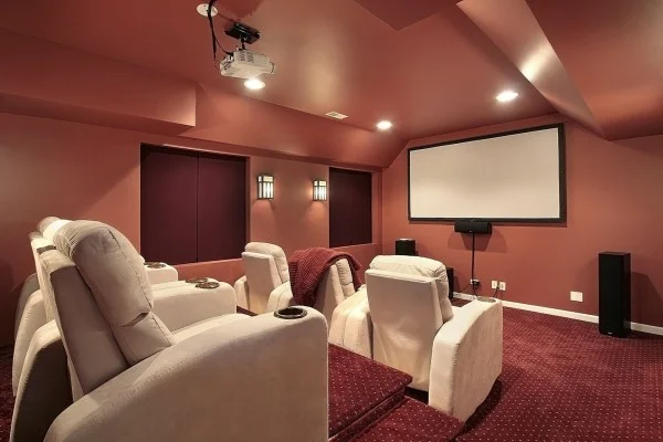 photo-of-home-theater-with-red-painted-walls-and-white-leather-recliners-Custom-600x400.jpg