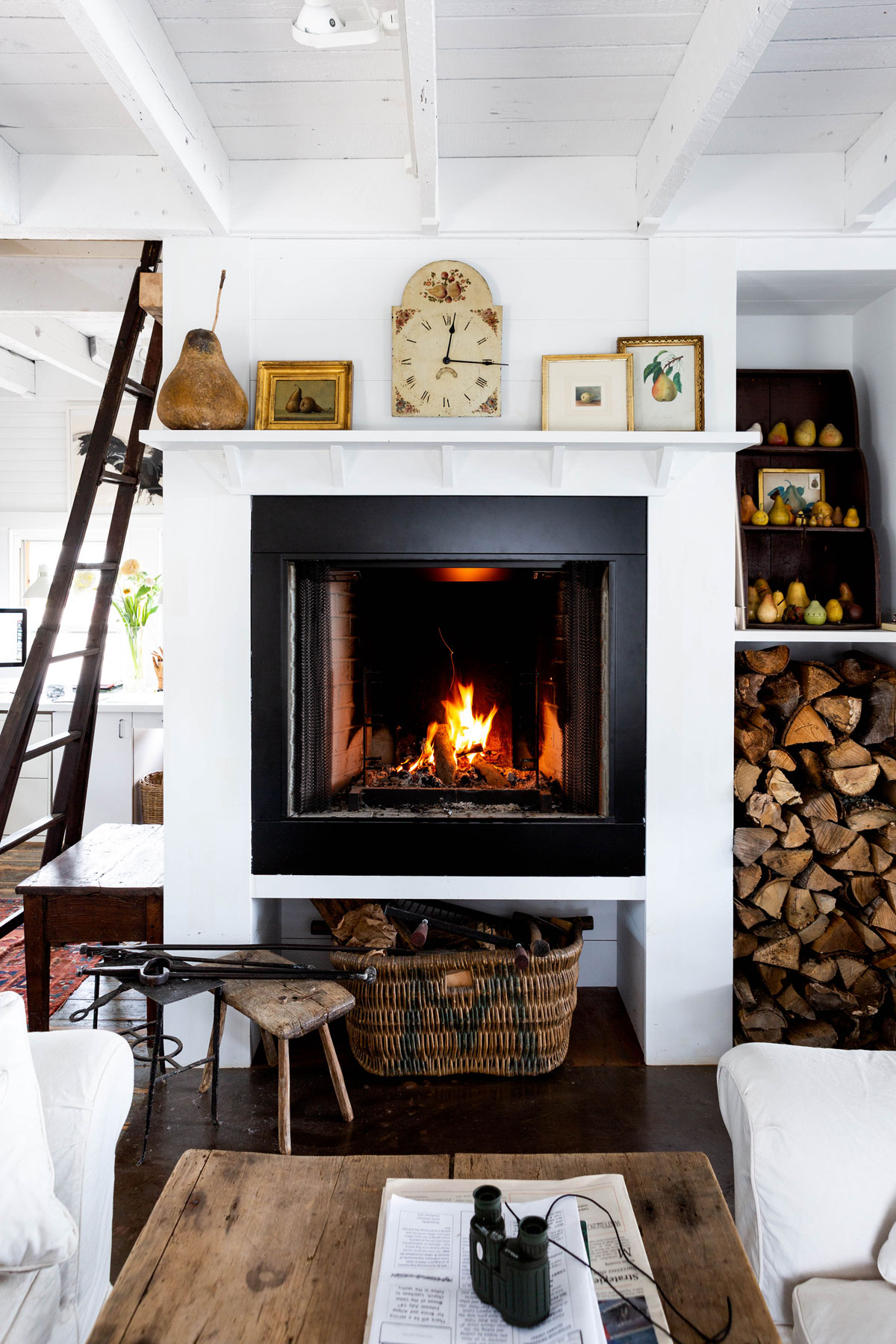 A good fireplace and a hefty woodpile are household requirements in Maine, even on midsummer nights. That’s why Paul planned for a built-in firewood niche. Fuel for the fire is always within reach.
