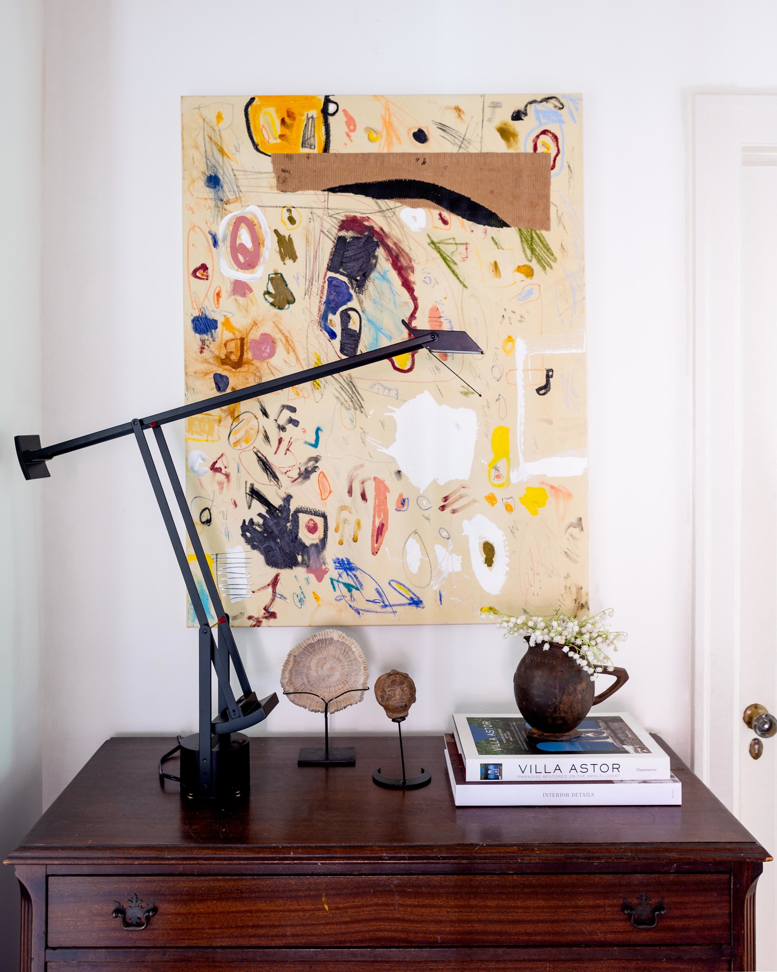 One of McLure’s abstract canvases is hung above an antique chest that he’s had since he was 13. The sculptures were Christmas gifts from Mama McLure.