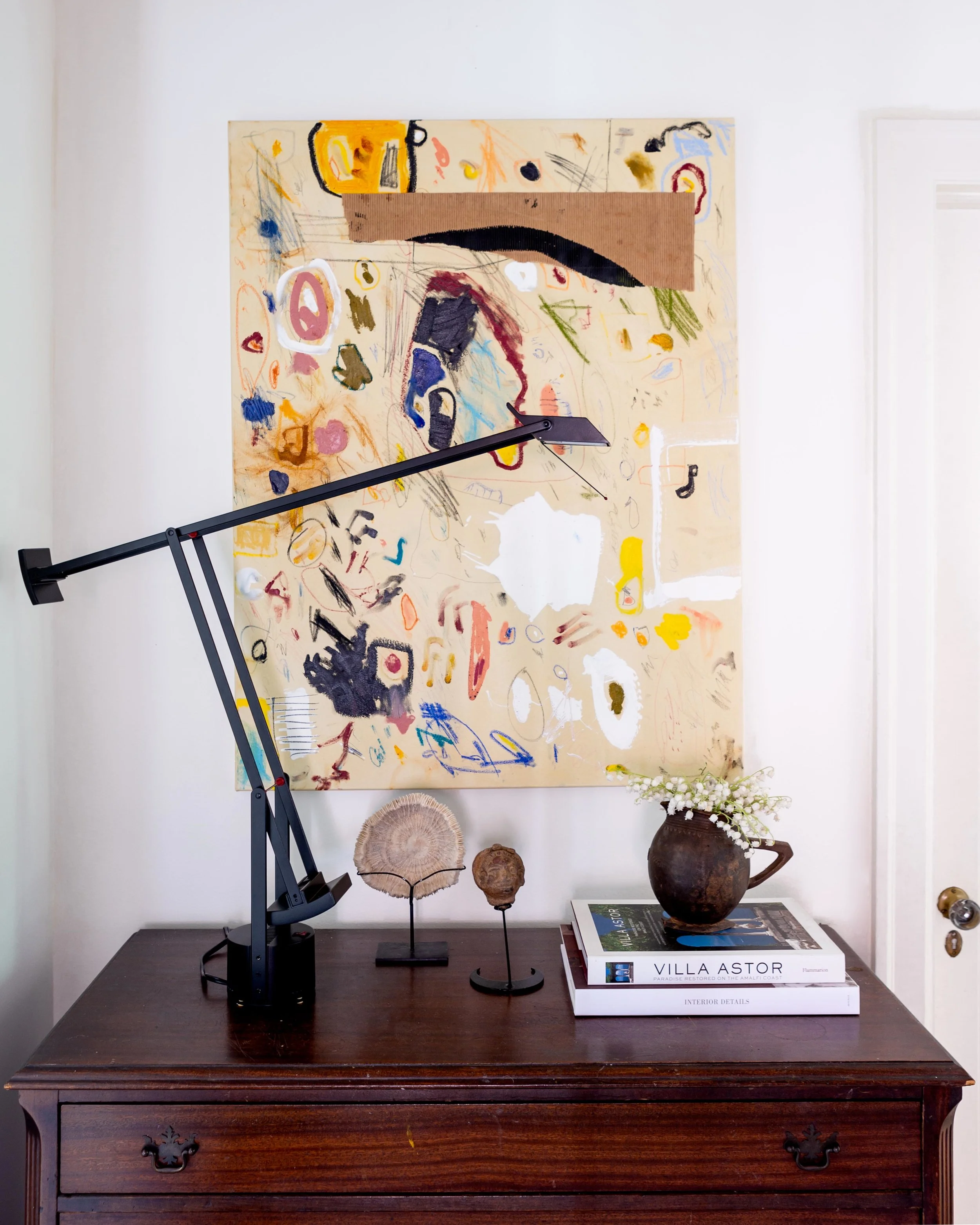 One of McLure’s abstract canvases is hung above an antique chest that he’s had since he was 13. The sculptures were Christmas gifts from Mama McLure.