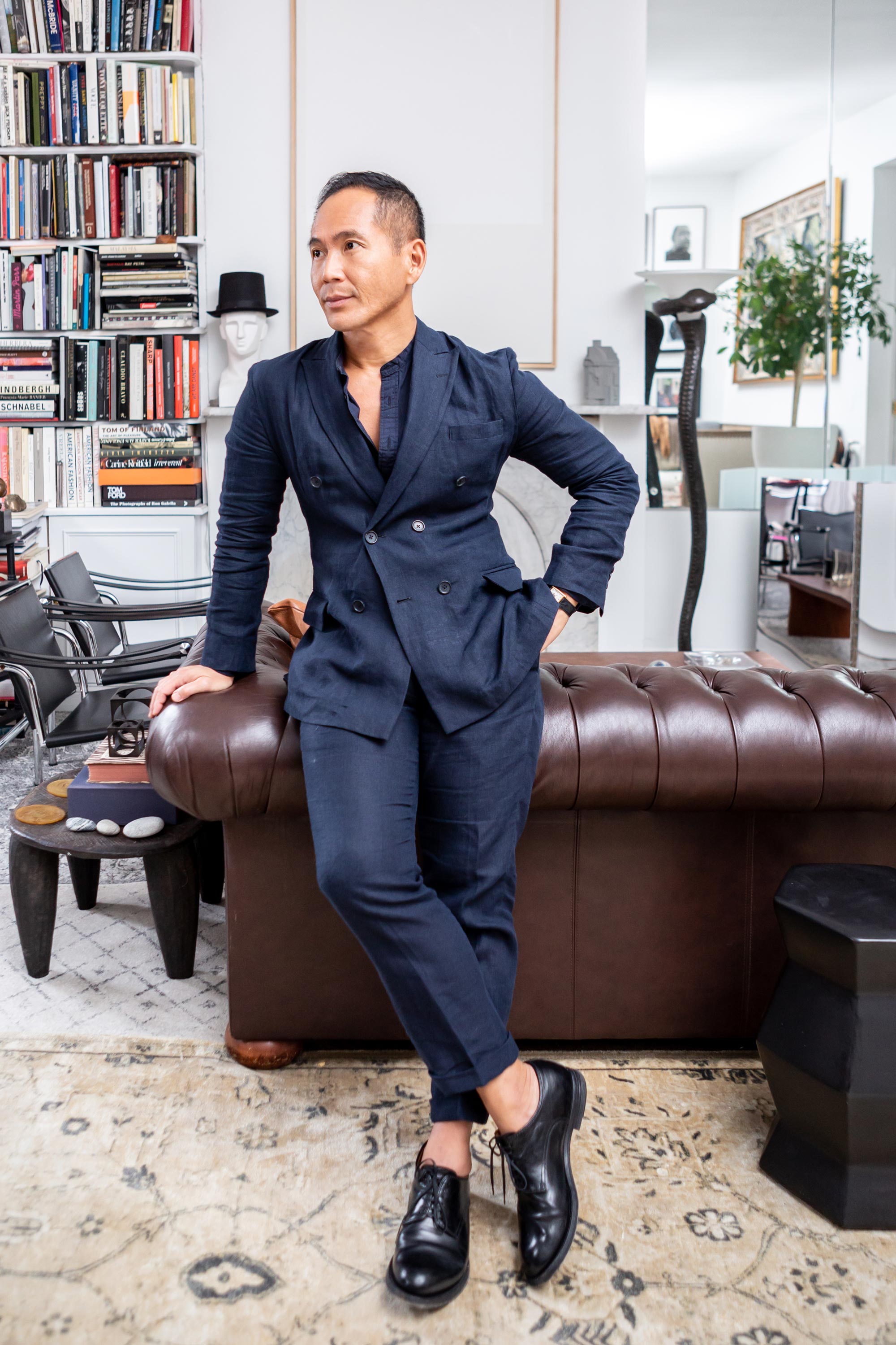 Marcus Teo in his little museum of an apartment.