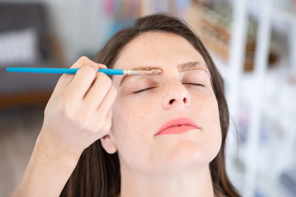 “A tinted brow is better,” West says. It adds definition, structure, and a certain boldness to the eyes.