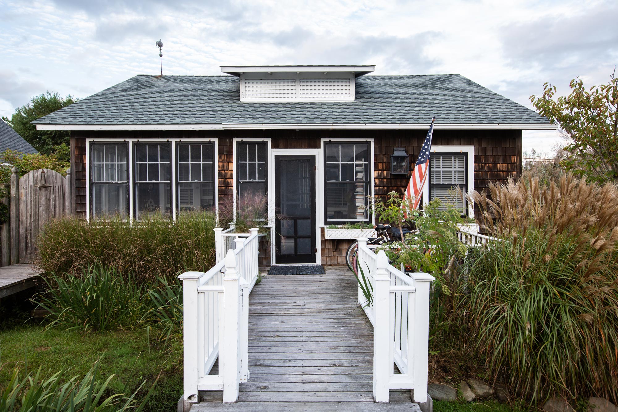 “Everything’s on stilts,” Bates says of Fire Island’s flood-resistant houses and other structures. “Our place is a lower one. We’re about four feet off the ground. Since Hurricane Sandy, a lot of people have had to raise their houses; we haven’t gotten to that point yet, but we’ll probably have to do it in the next few years.”