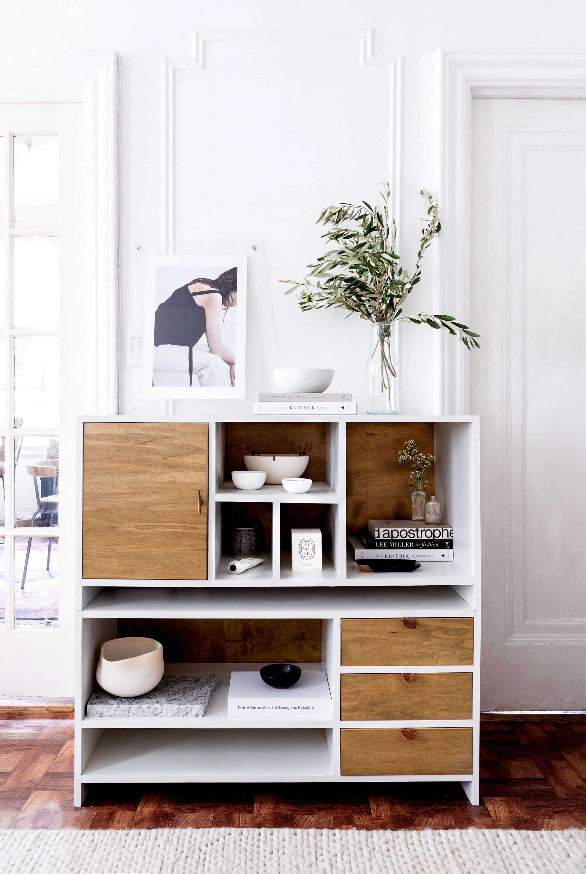 “Nothing’s quite perfect, and I think that’s OK; it’s like the Japanese concept of wabi-sabi,” De Smet says of the studio. “But we don’t get any direct sun, and letting as much natural light in as possible was very important. So I was like, ‘We have to paint it bright white!’ and it made such a difference.” She also brought in “a plush, white wool rug that really brightens everything up.”