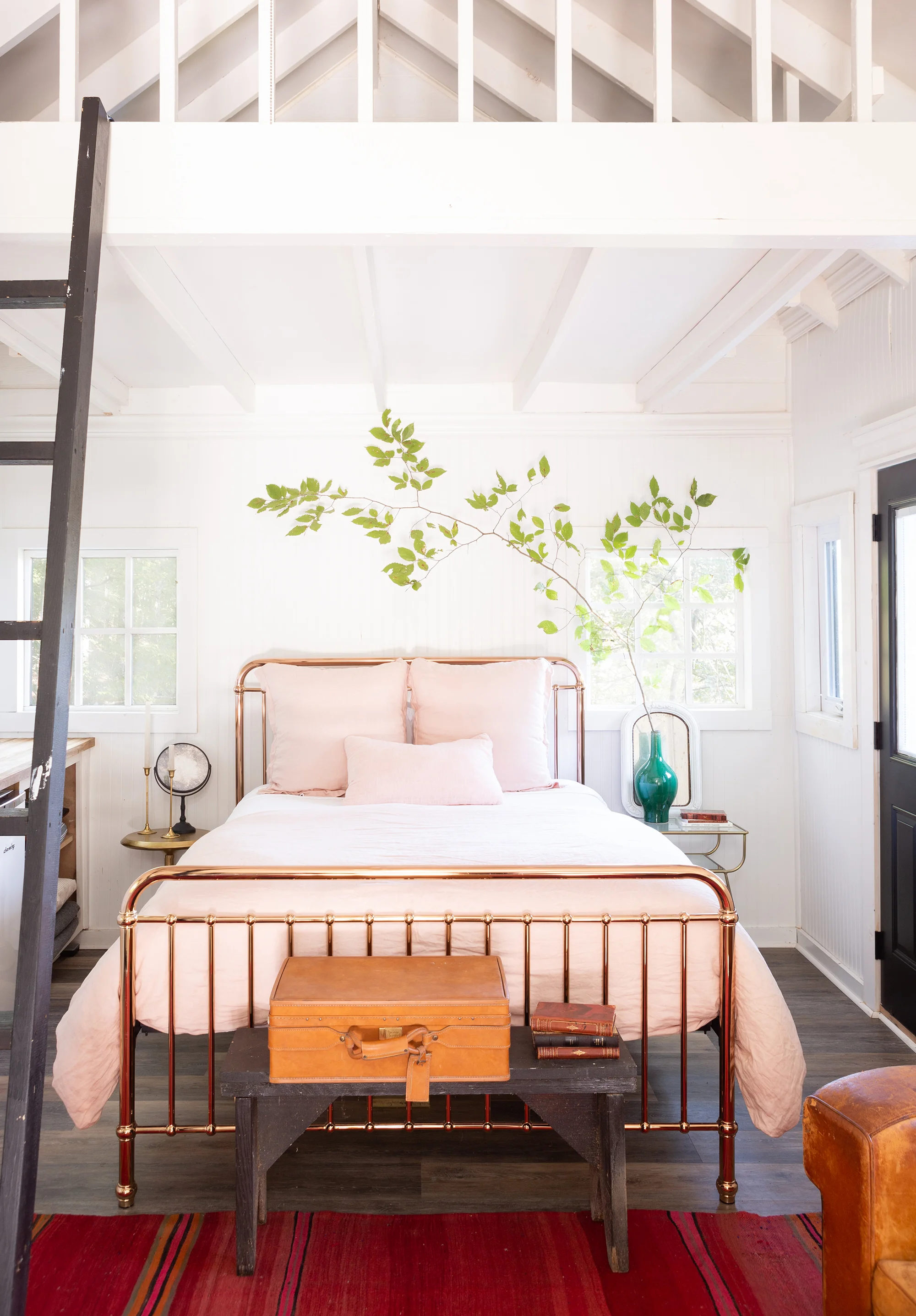 “I may throw in a beautiful, antique French leather club chair with a nice Woolrich flannel throw. That gives a nod to cozy cabin style without overdoing it,” Holly explains. “Even painting an interior a very pale gray instead of beige or brown. I’ve tried to make the cabins feel very modern, as well as clean and fresh and warm and woodsy and luxurious.”