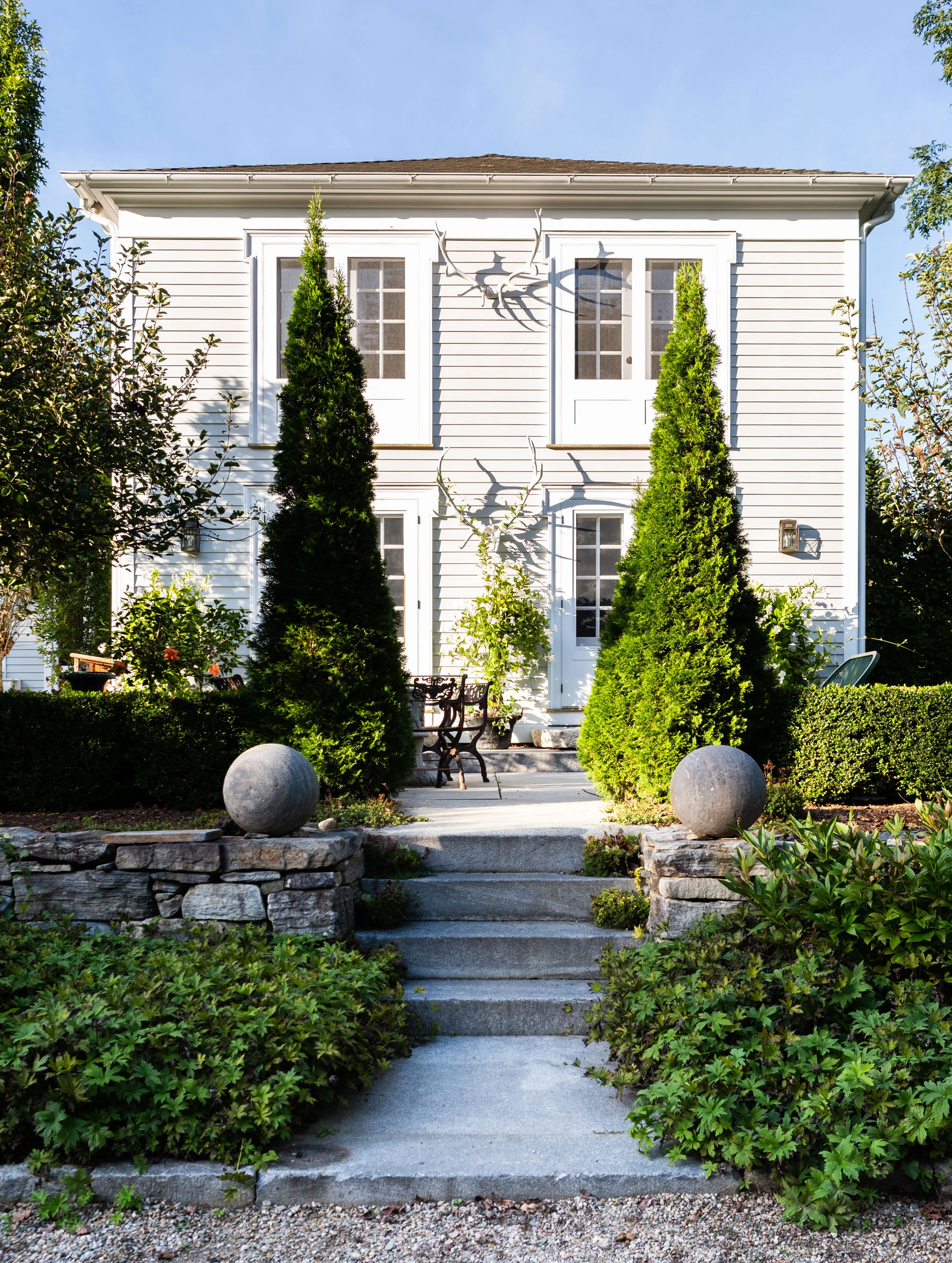 The Randalls’ 209-year-old Litchfield County residence and grounds is like its own tiny hamlet within its tiny hamlet, Cornwall Village. “Our home was built as the Foreign Mission School, and the schoolhouse was a little building that’s still standing out back, which is now a church,” Natalie explains. “On our property, we have little buildings that were once the town hall and the library; now they’re little guest cottages.”