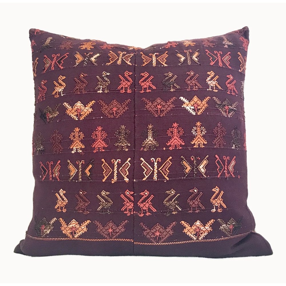 A chocolate brown vintage textile pillow made from a Guatemalan huipil, $105.80, Etsy