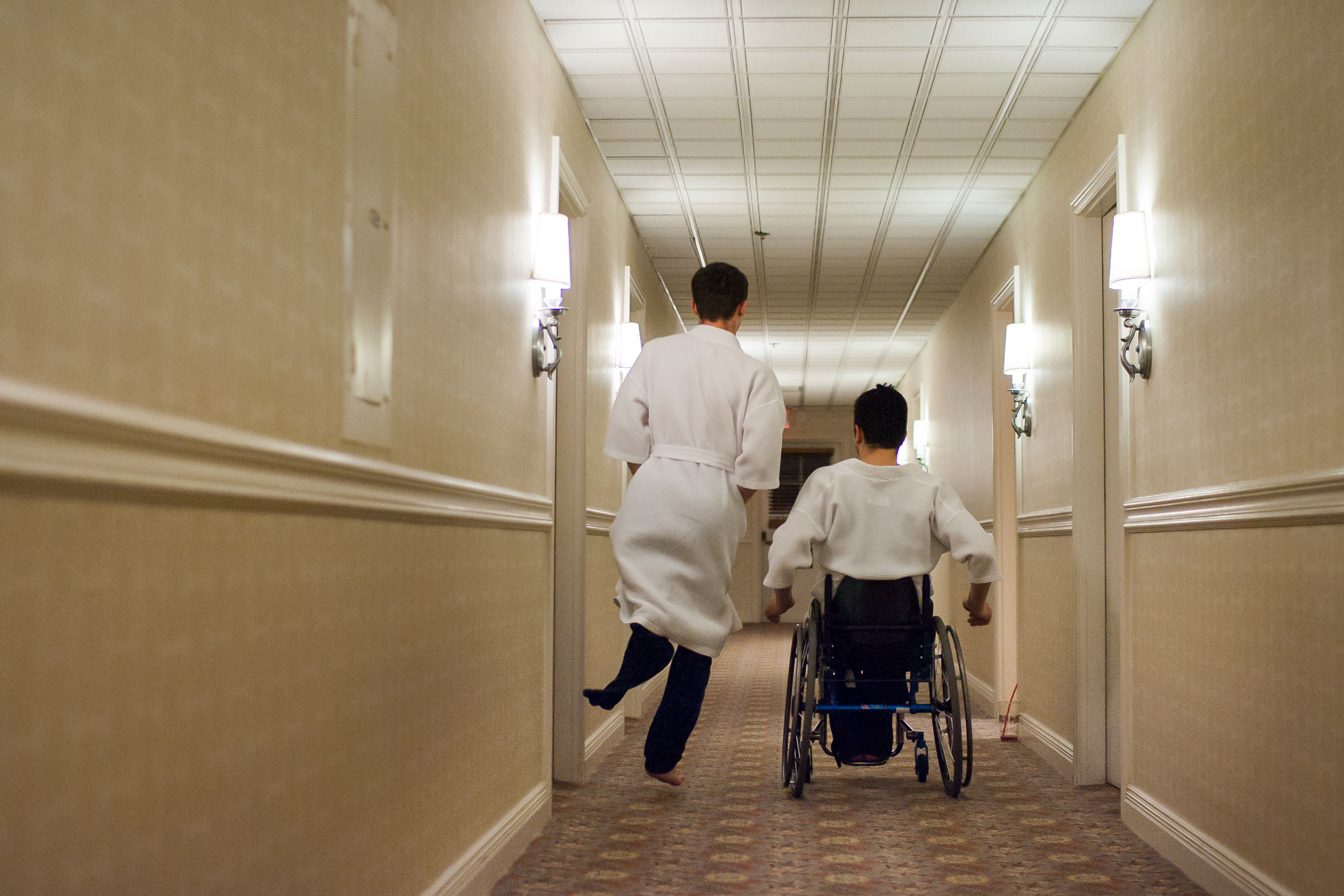Tom Smurr and Jaime Balthazar proceed down the hallway of their hotel later that night.