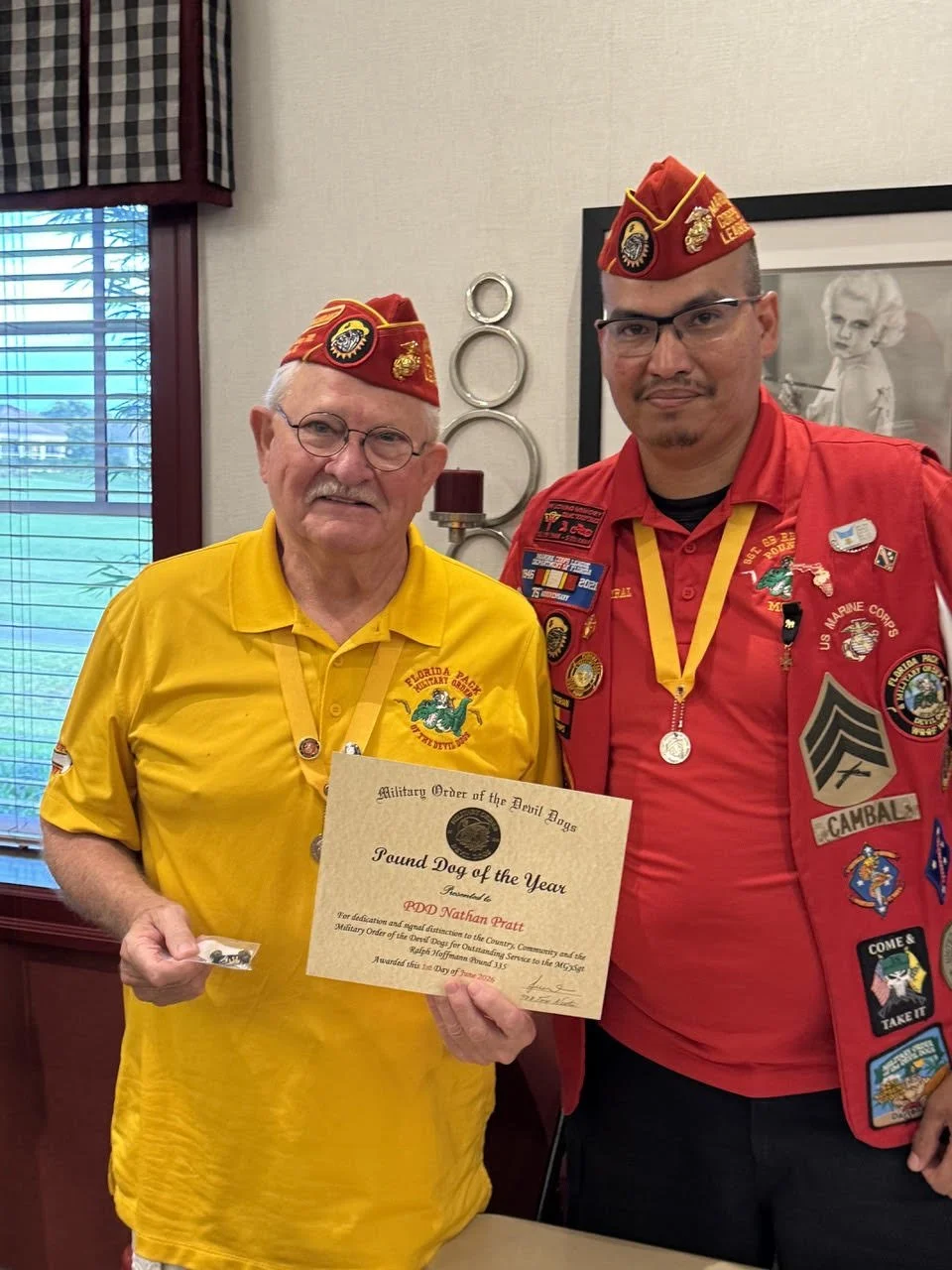 PDD Nathan Pratt receiving the MGySgt Ralph Hoff Pound 335 Dog of the Year 6-1-26