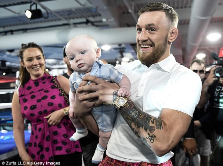 Conor McGregor with his girlfriend and son