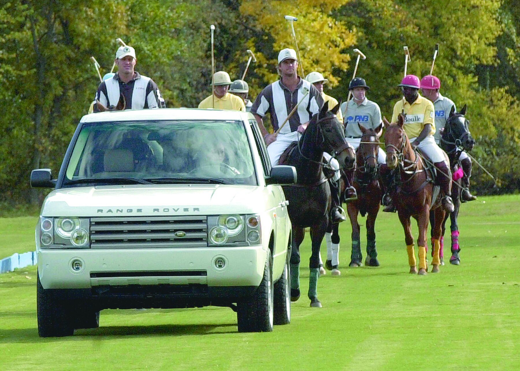 Range Rover leading polo team.jpg