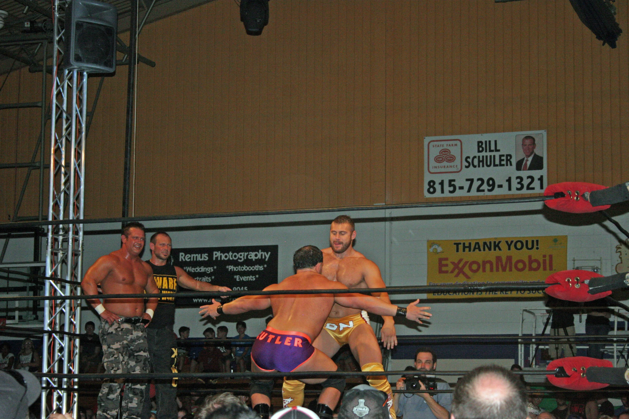 Brian Christopher (aka Grandmaster Sexay), left, and Scotty 2 Hotty watch Nick Cutler and Brian Nelson dance before their tag team match at Pro Wrestling Blitz's WrestleFest 5 in Joliet, Ill. on Aug. 9, 2014. (Photo by Mike Pankow)