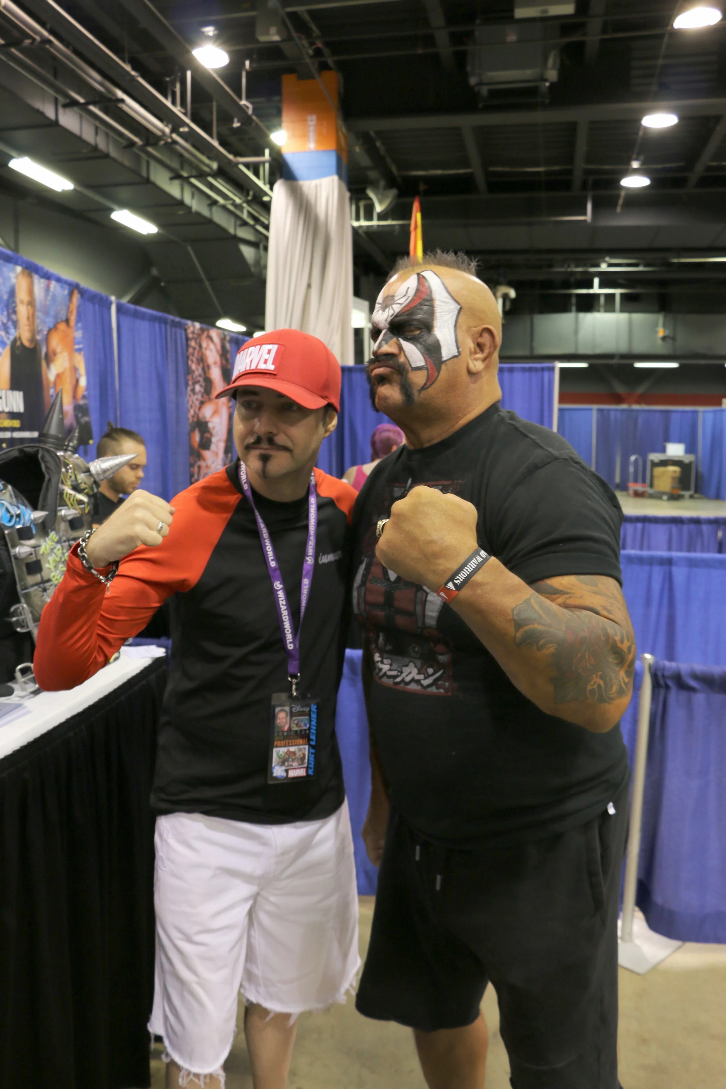 Famous artist and illustrator Kurt Lehner, left, who has worked for companies such as Marvel, Walt Disney Studios and DreamWorks, poses with legendary wrestler Road Warrior Animal at Wizard World Chicago at Donald E. Stephens Convention Center on Friday, August 24, 2018. (Photo by Mike Pankow)