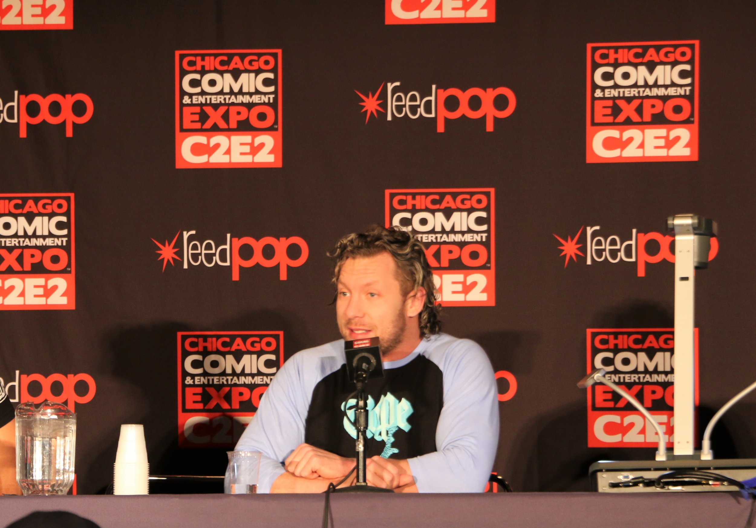  Kenny Omega answers a fan question during the All Elite Wrestling panel. 
