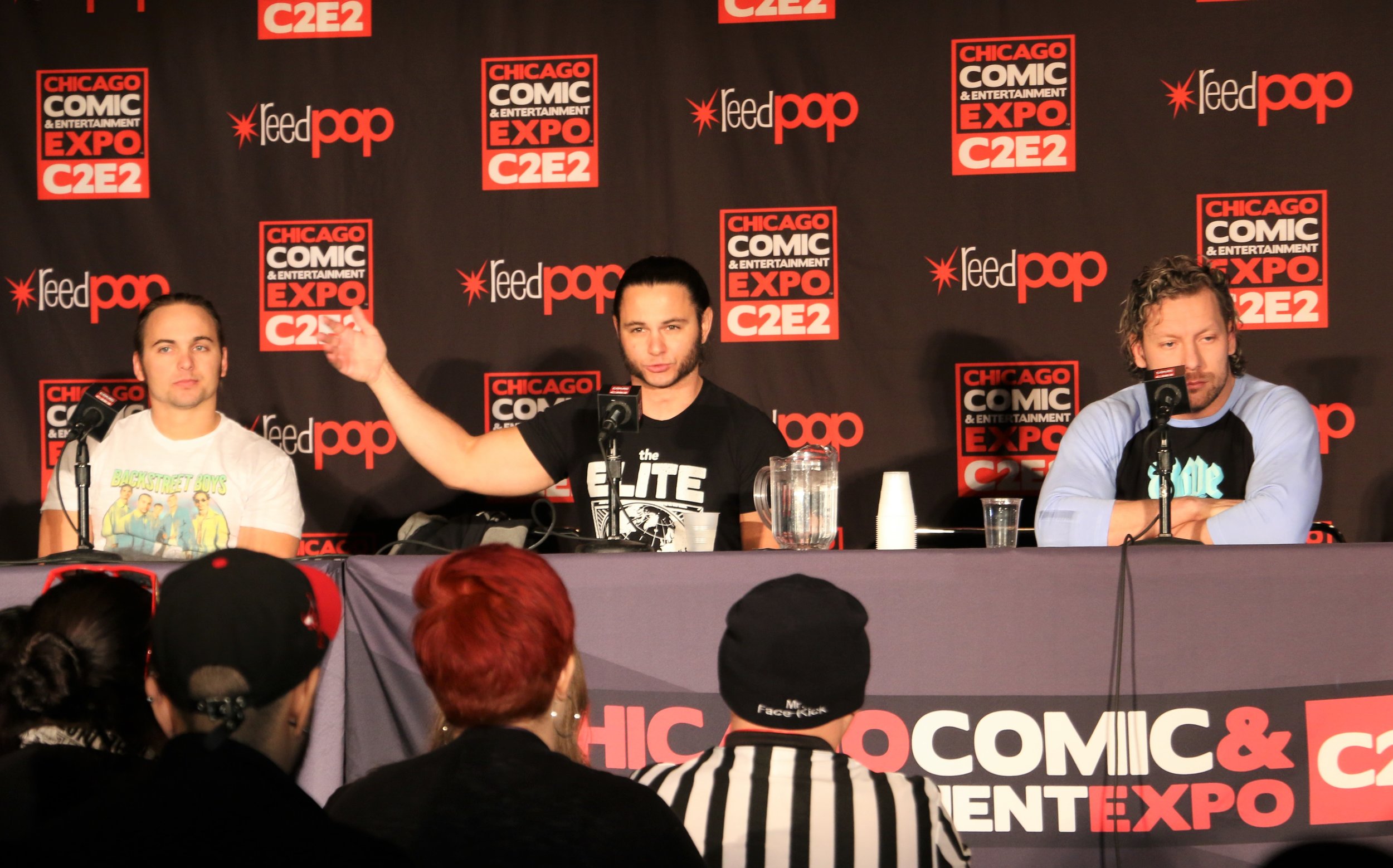  Matt Jackson, center, speaks during the All Elite Wrestling panel as Nick Jackson, left, and Kenny Omega flank him. 