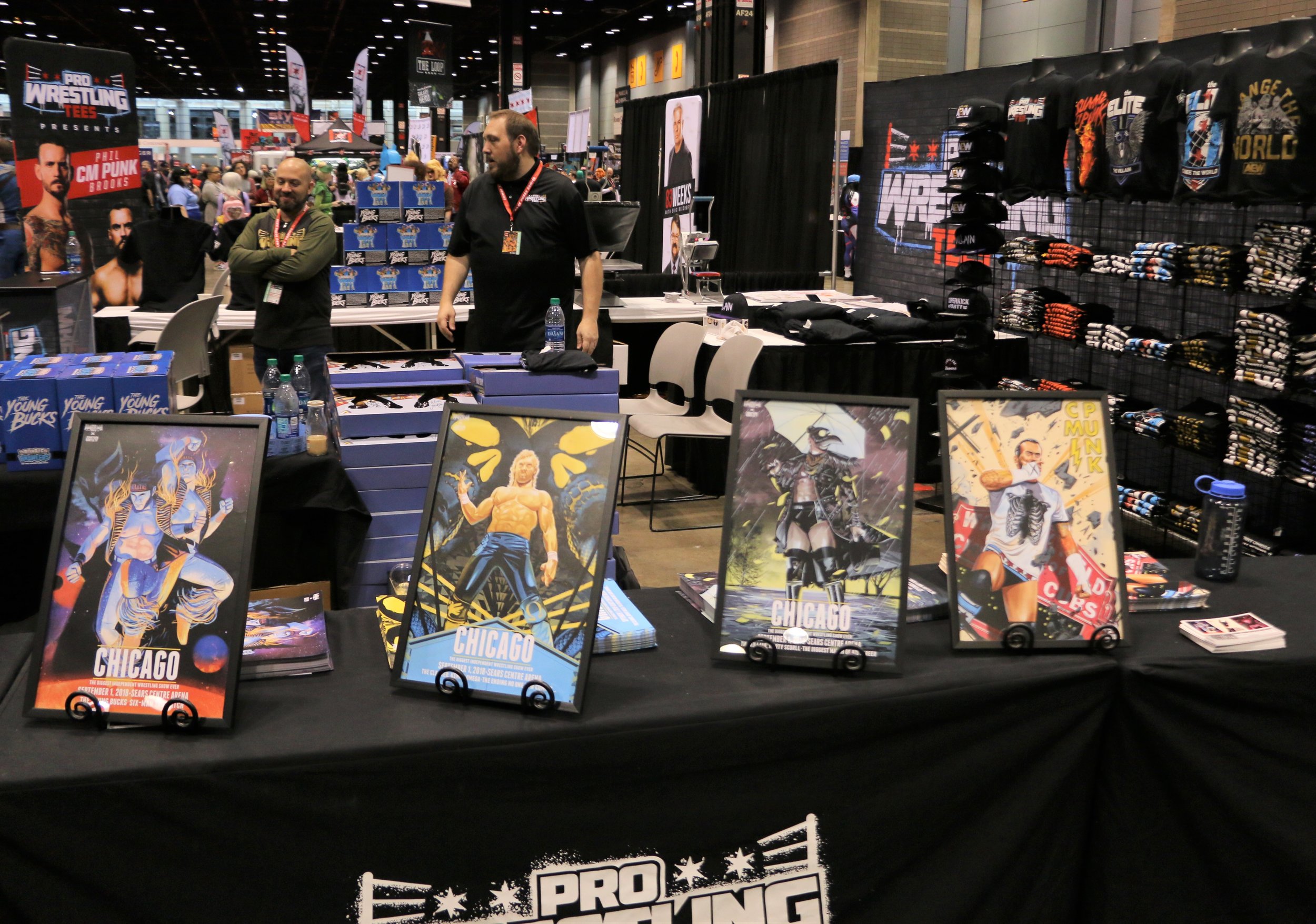  Cool portraits and merchandise at the Pro Wrestling Tees booth. 