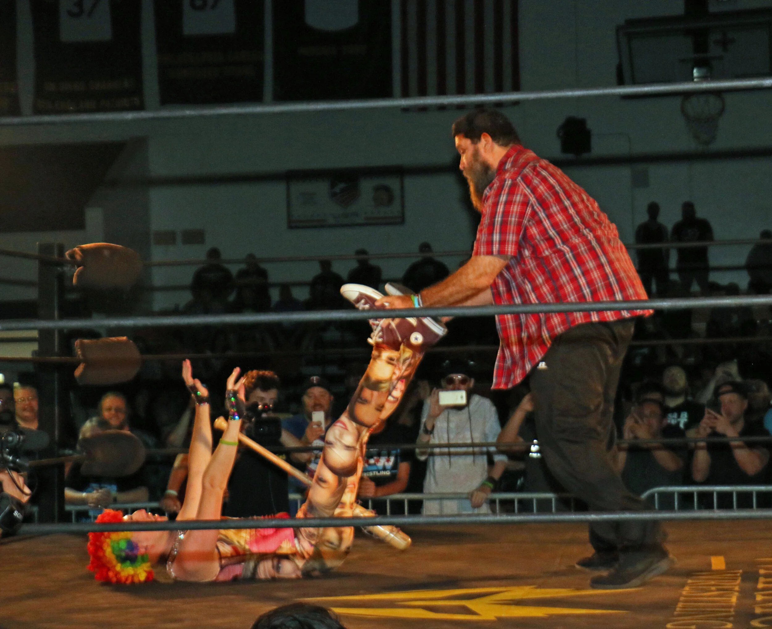 WWE Hall of Famer Mick Foley has Frank the Clown in a compromising position. (Photo by Mike Pankow)