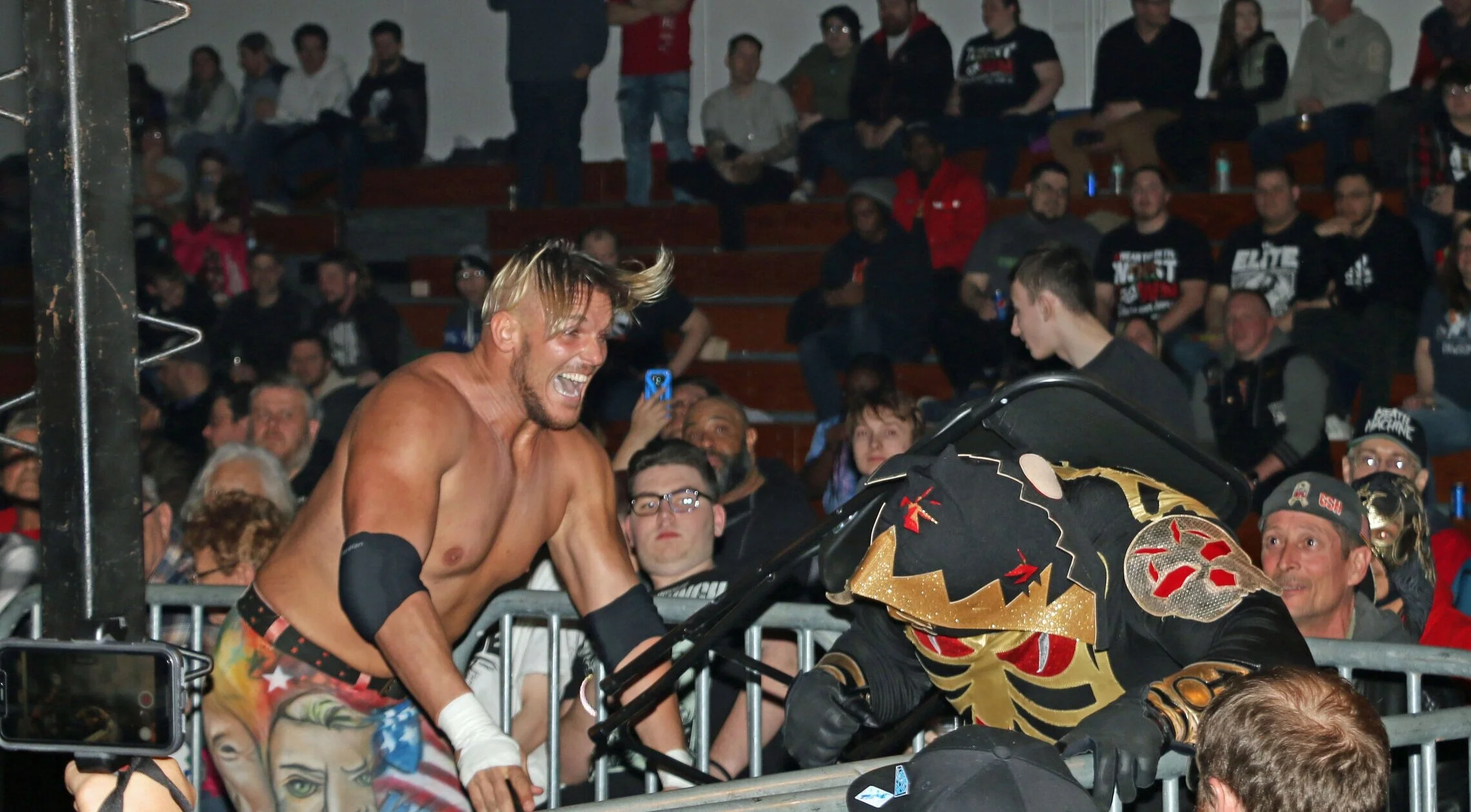Sam Adonis blasts LA Park with a chair during Warrior Wresling 4 on March 15, 2019 at Marian Catholic High School in Chicago Heights, Ill. (Photo by Mike Pankow)