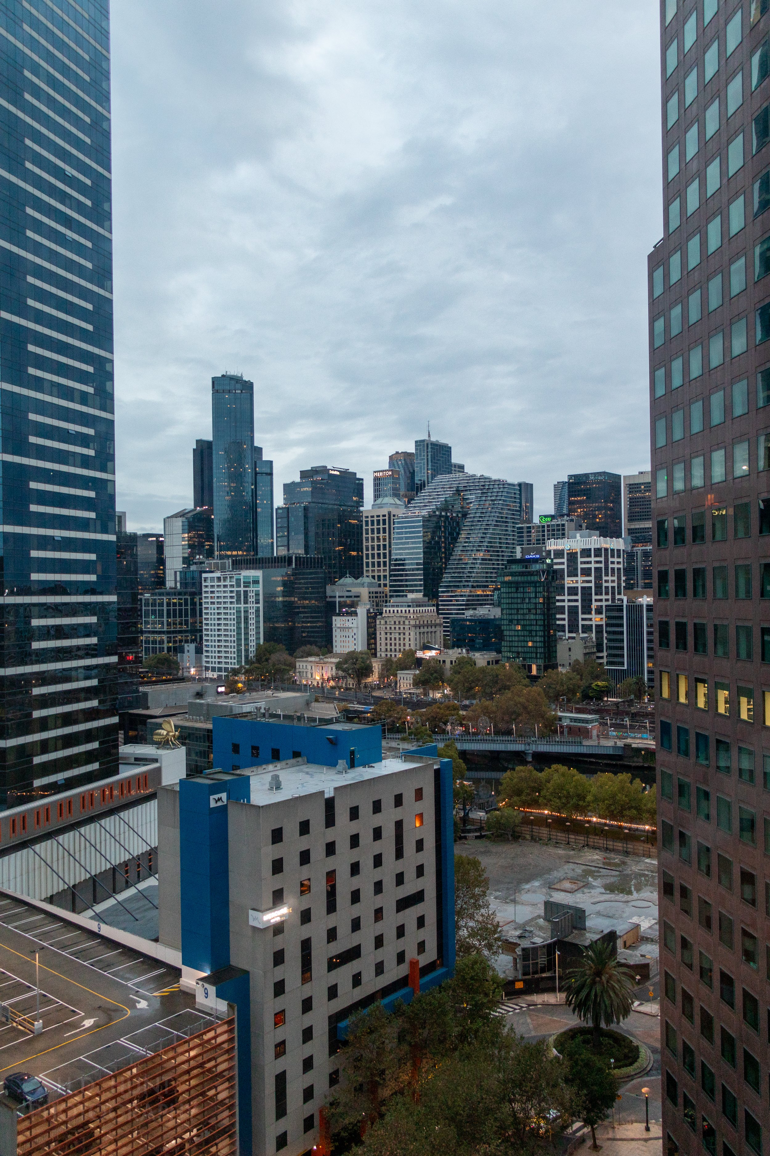 Skyscrapers rise above the city of Melbourne, Australia, on an overcast day.