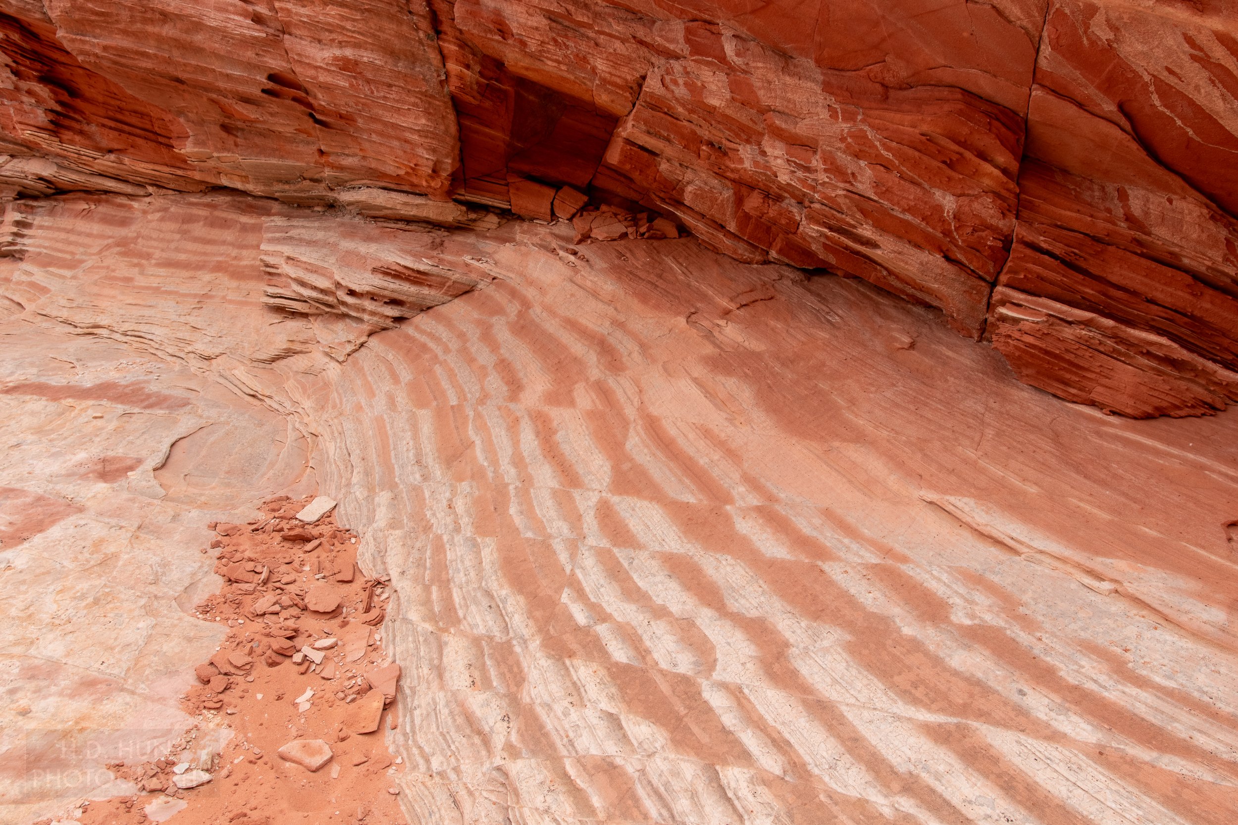 A block of deformed striped red and white sandstone is seen in White Pocket, Vermillion Cliffs National Monument, Arizona, United States.