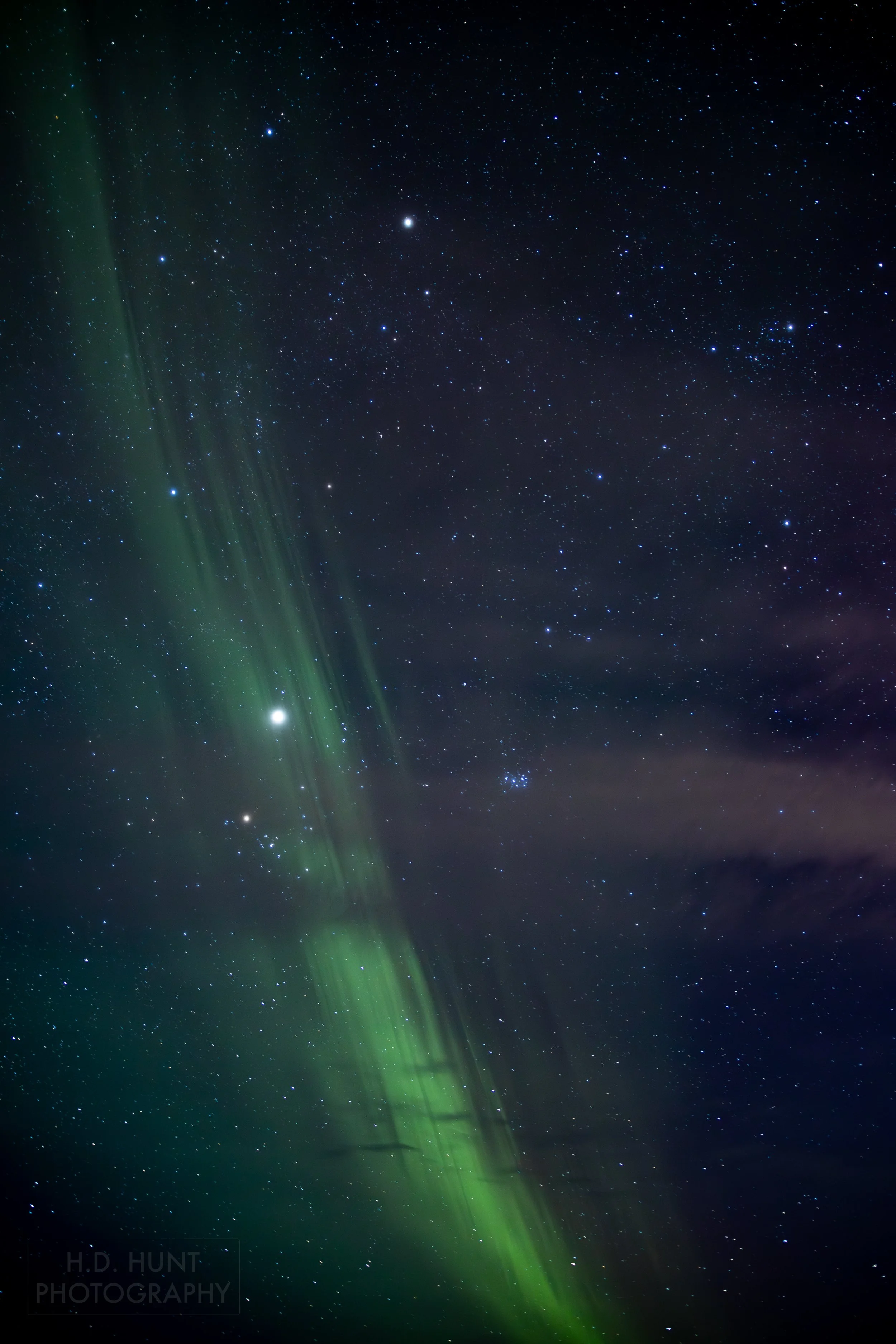 The green light of Aurora Borealis - the Northern Lights - is seen north of Grindavik on the Reykjanes Peninsula, Iceland.