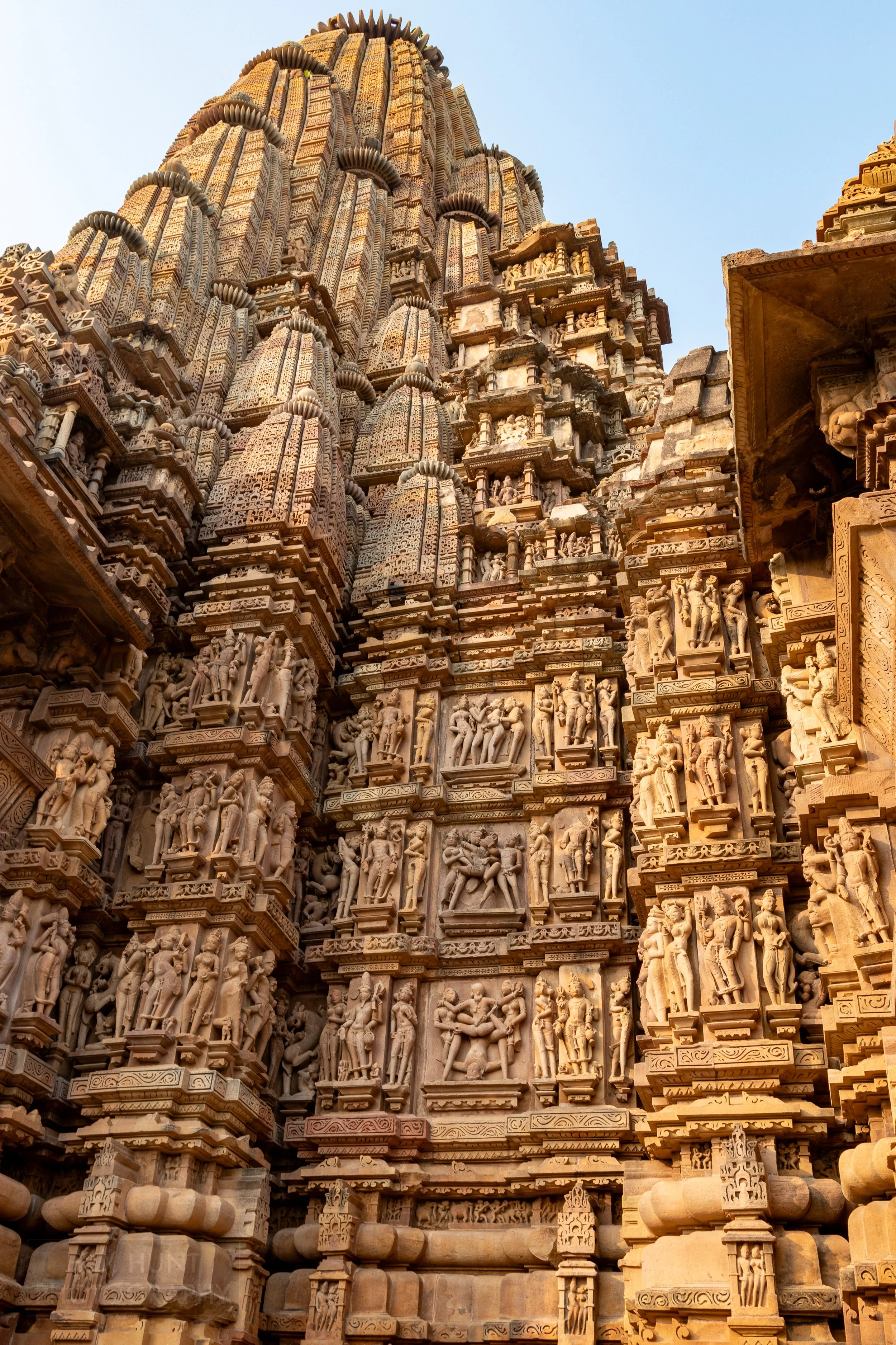 Close-up of the stone carvings adoring Kandariya Mahadeva, Khajuraho Group of Monuments, India.