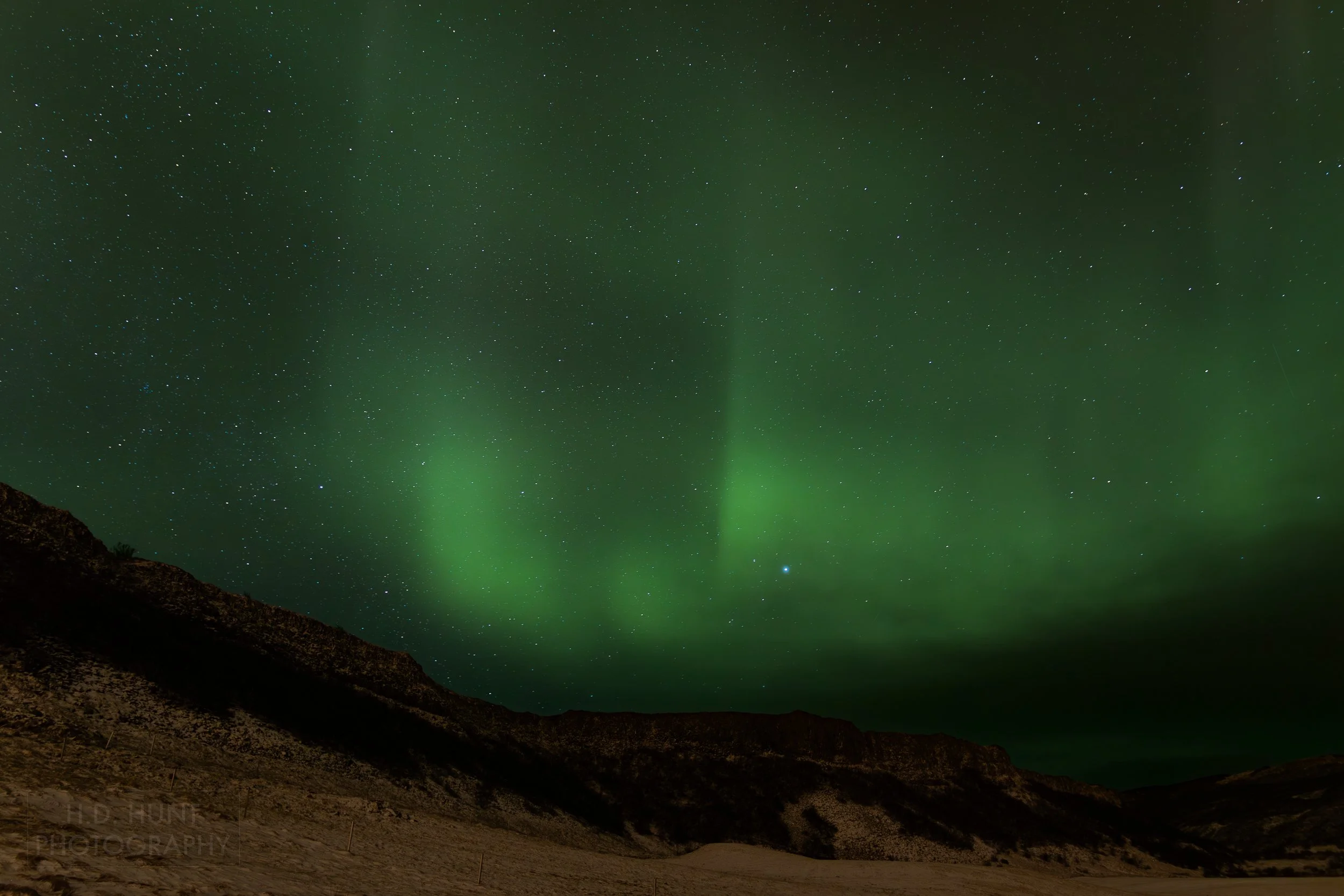 The green light of Aurora Borealis - the Northern Lights - is seen north of Reykholt í Biskupstungum, Iceland.