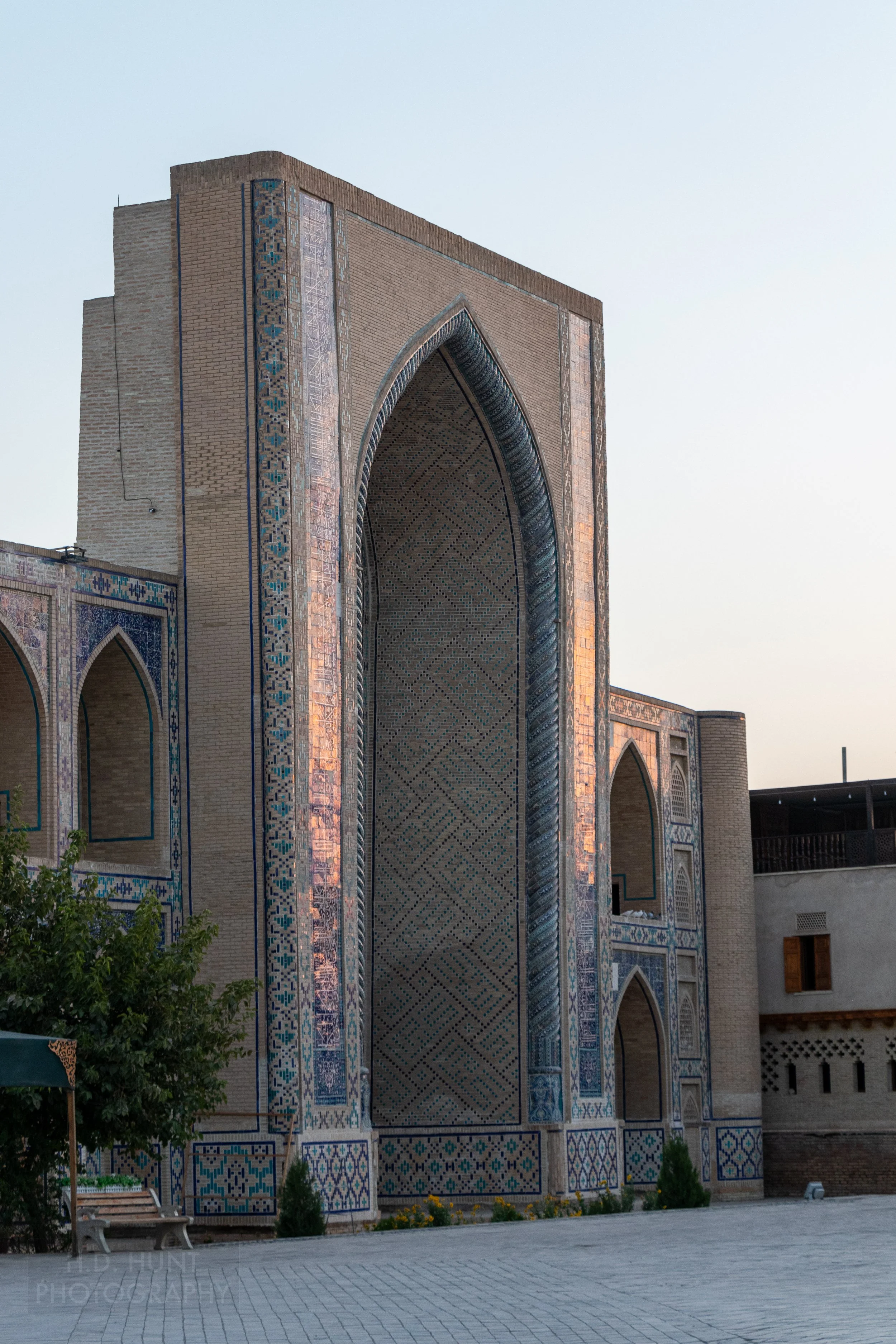 The tiled facade of the Ulugh Beg Madrasa in Bukhara, Uzbekistan.