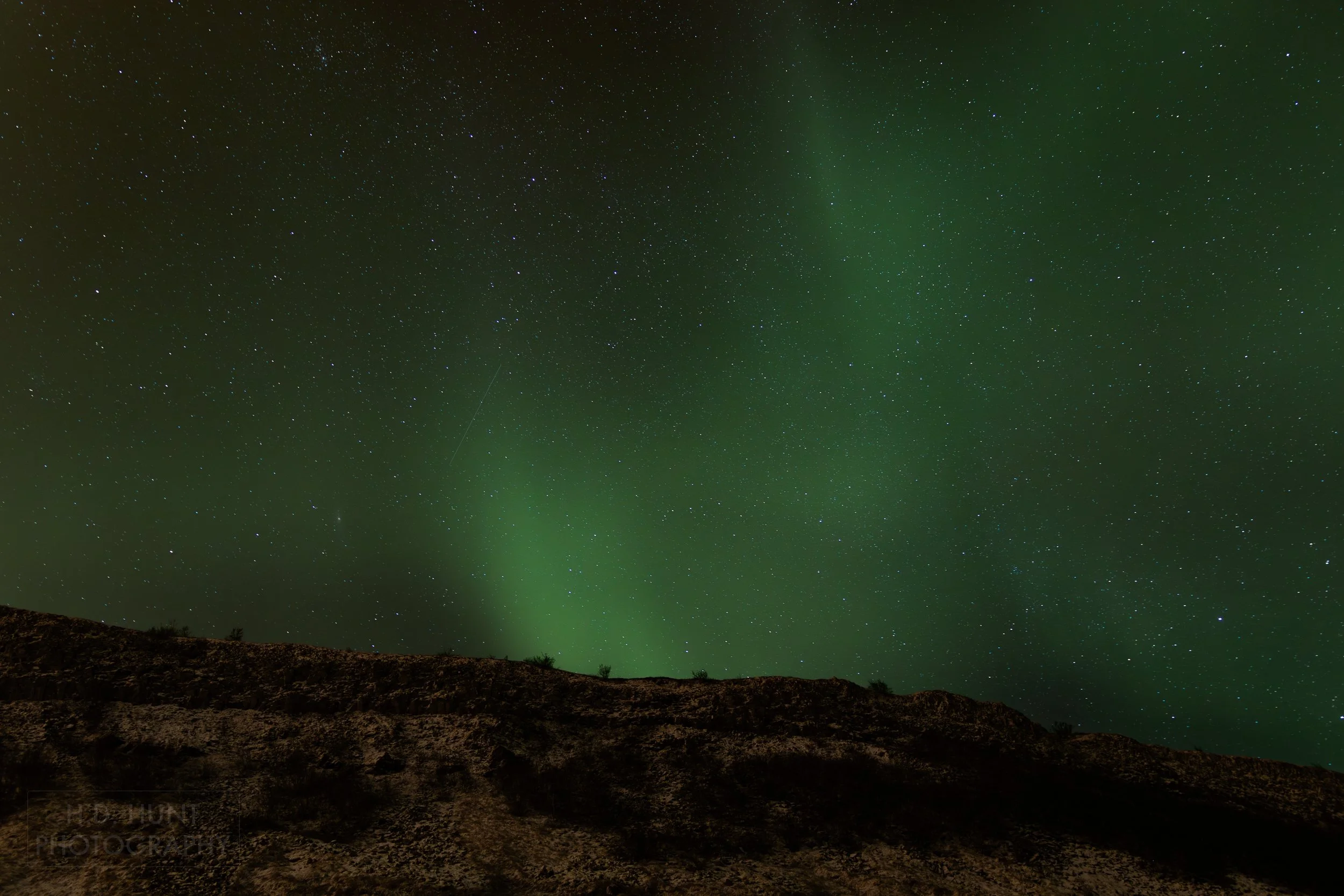 The green light of Aurora Borealis - the Northern Lights - is seen north of Reykholt í Biskupstungum, Iceland.