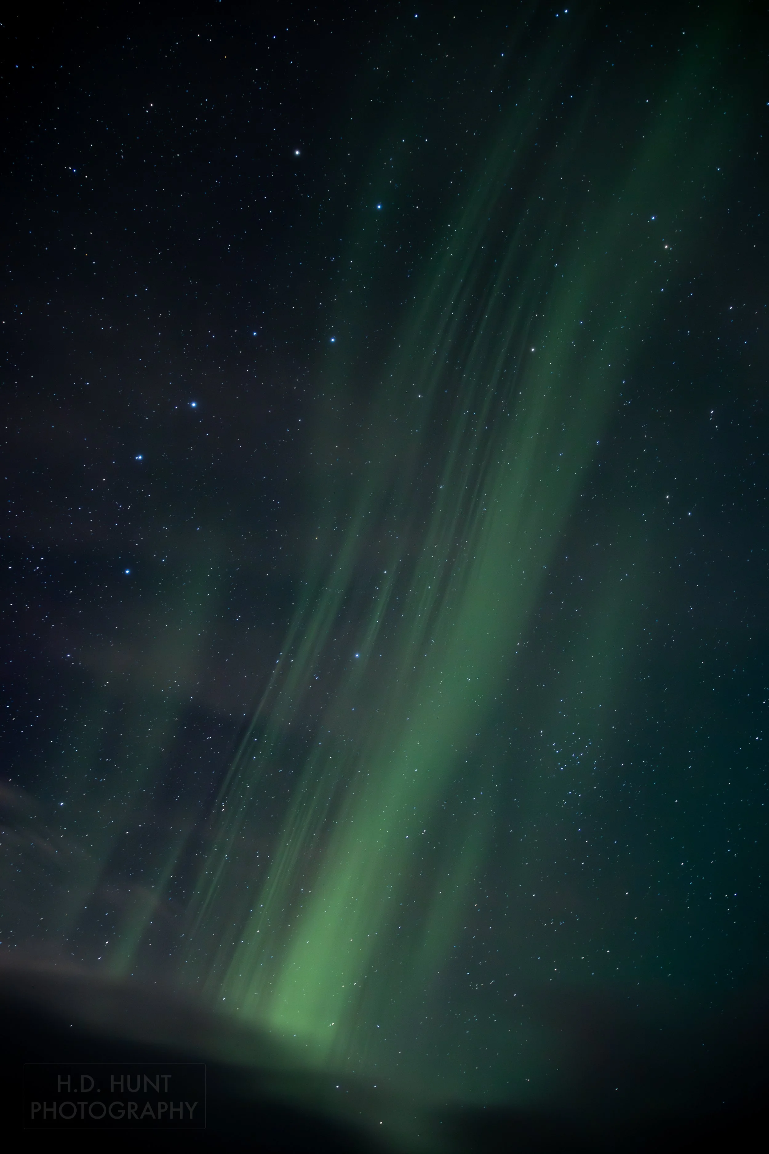 The green light of Aurora Borealis - the Northern Lights - is seen north of Grindavik on the Reykjanes Peninsula, Iceland.