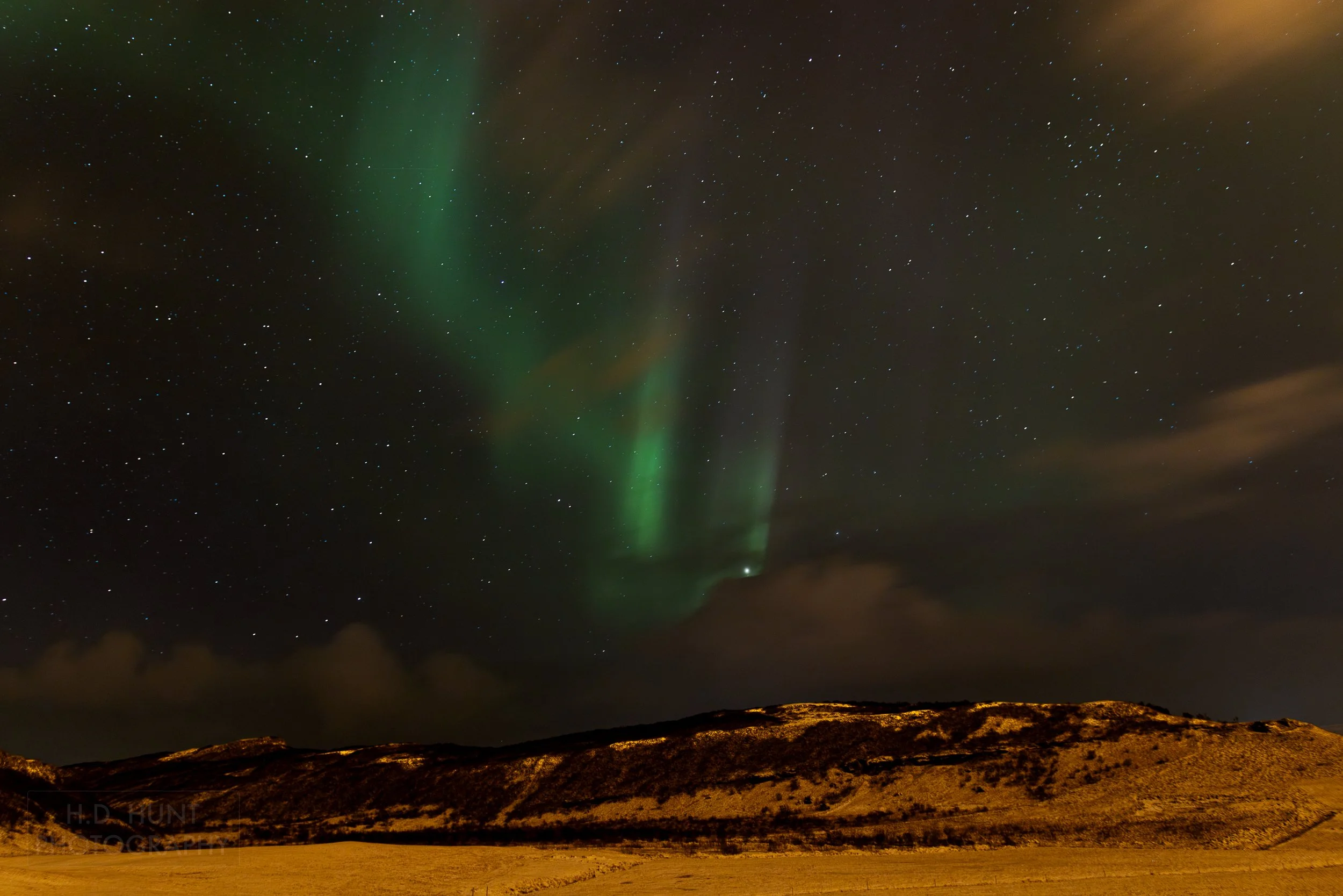 The green light of Aurora Borealis - the Northern Lights - is seen north of Reykholt í Biskupstungum, Iceland.
