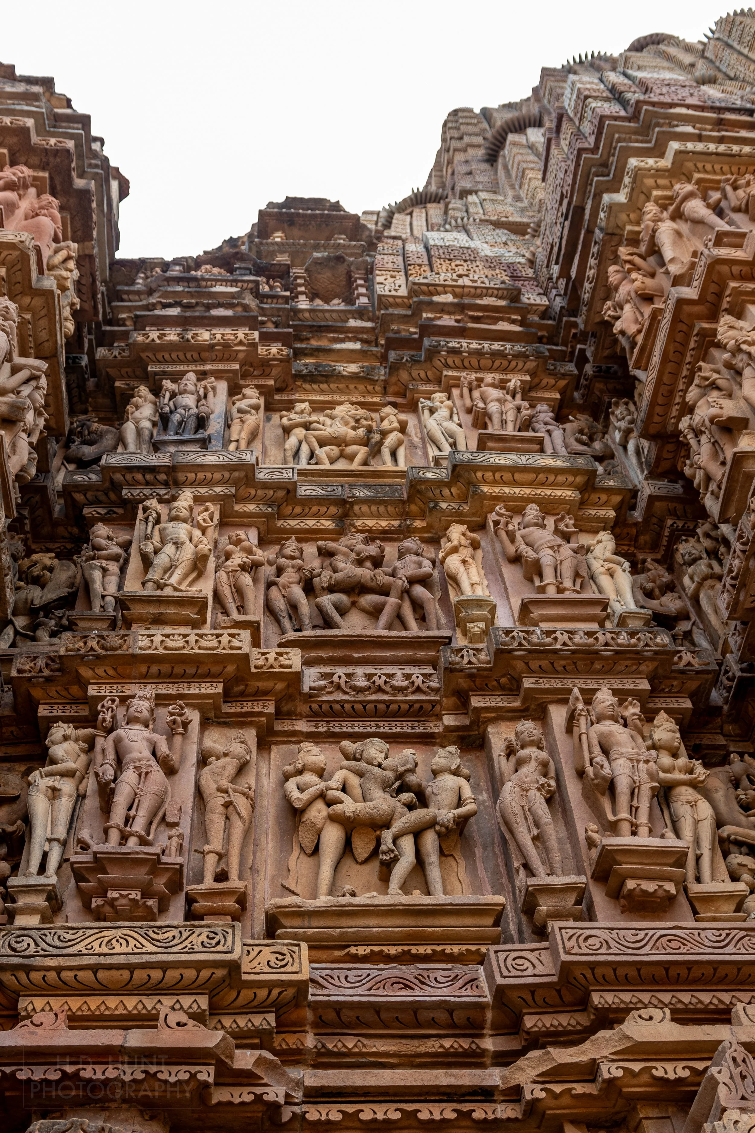 Close-up of the stone carvings adoring Kandariya Mahadeva, Khajuraho Group of Monuments, India.