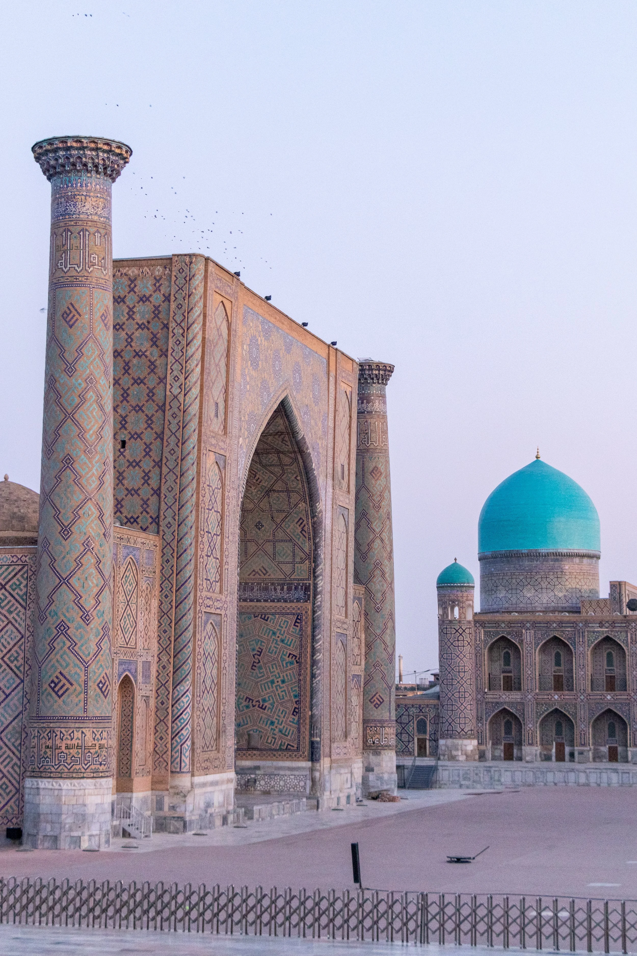The facade of the Ulugh Beg Madrasa illuminated at sunrise, Registan, Samarkand, Uzbekistan.