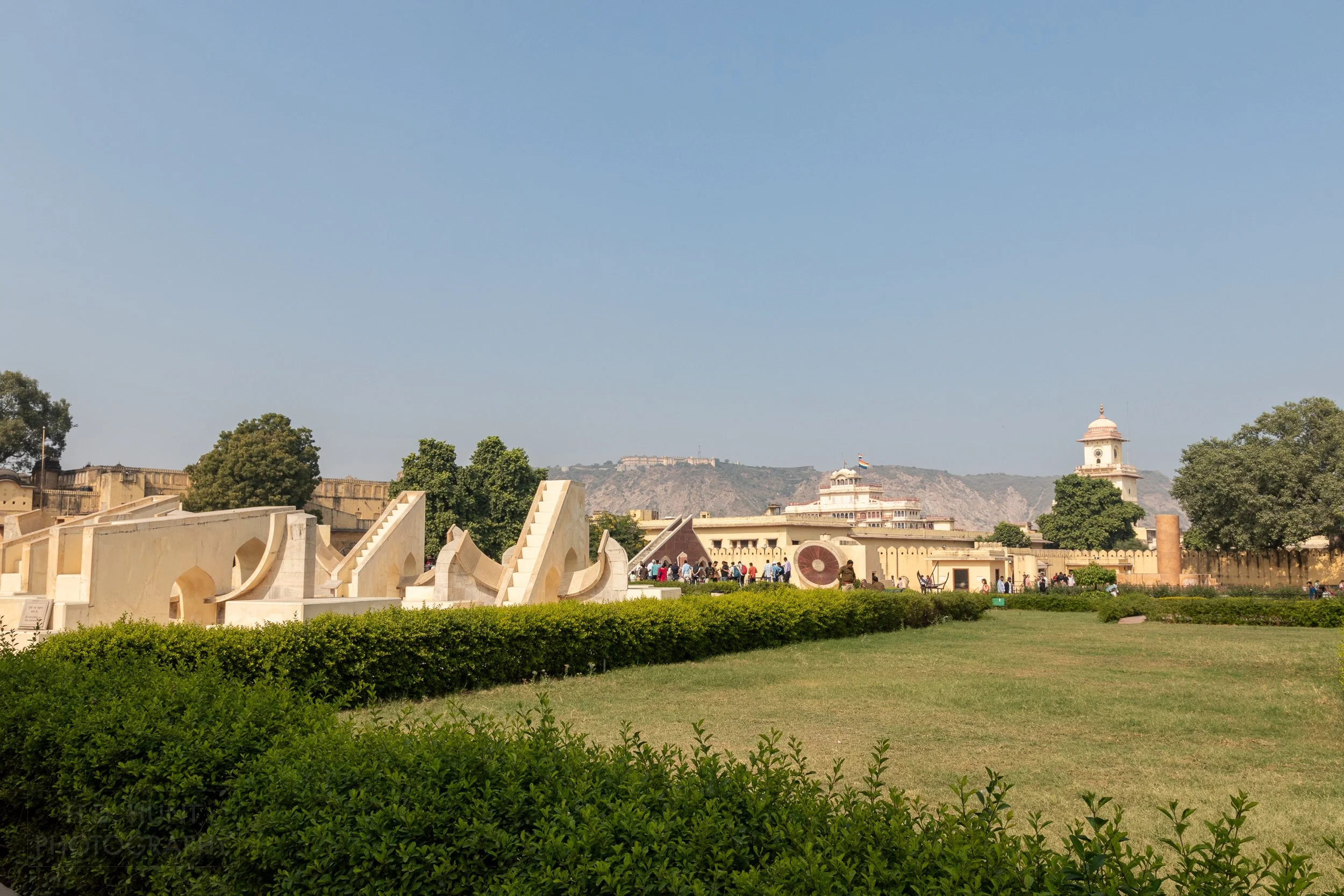 Several yellow stone observatory instruments are seen at Jantar Mantar, Jaipur, India.