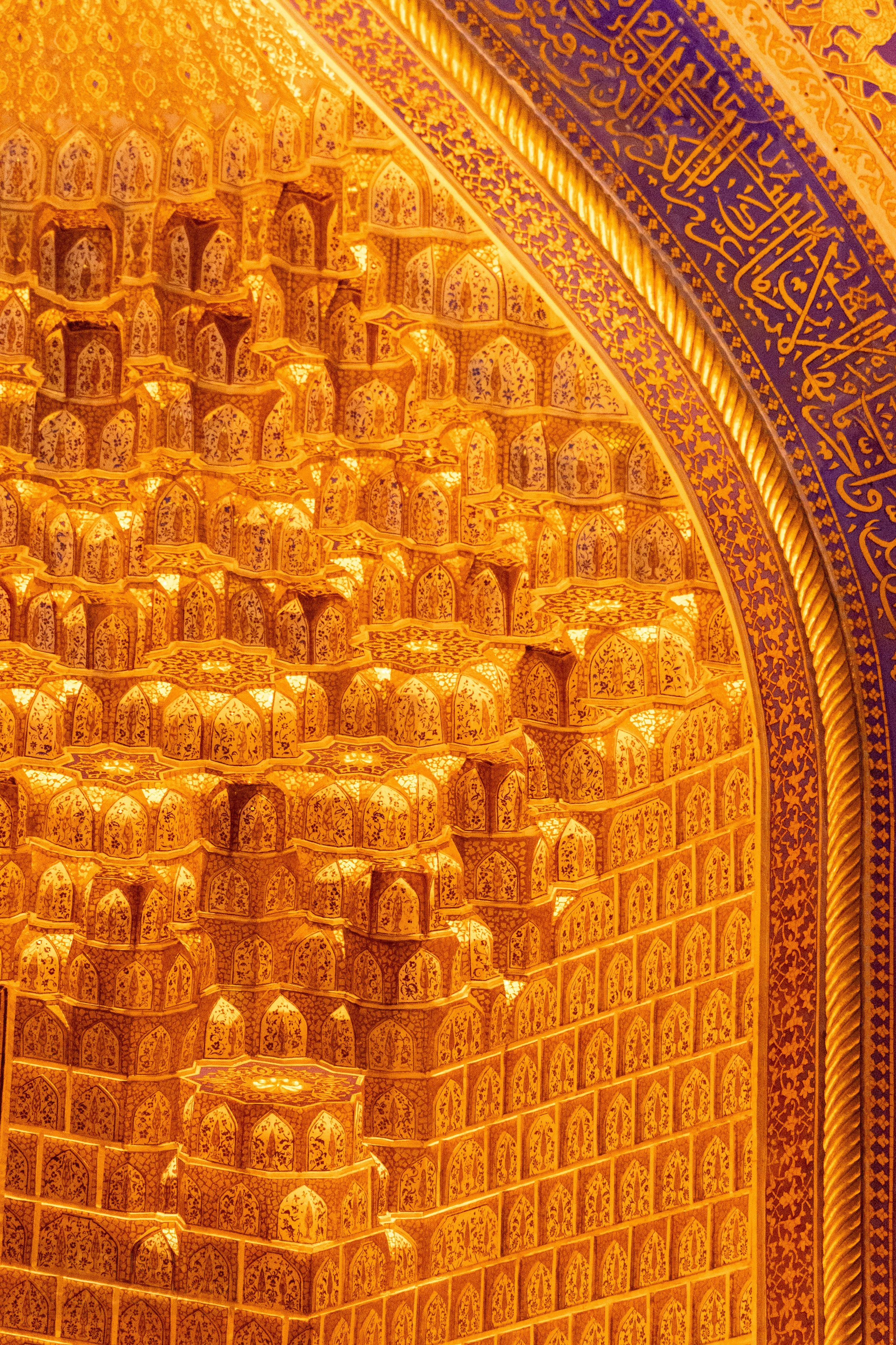 Close-up of an arch at the Museum of the History of the Registan Complex featuring a vibrant gold finish, Registan, Samarkand, Uzbekistan.