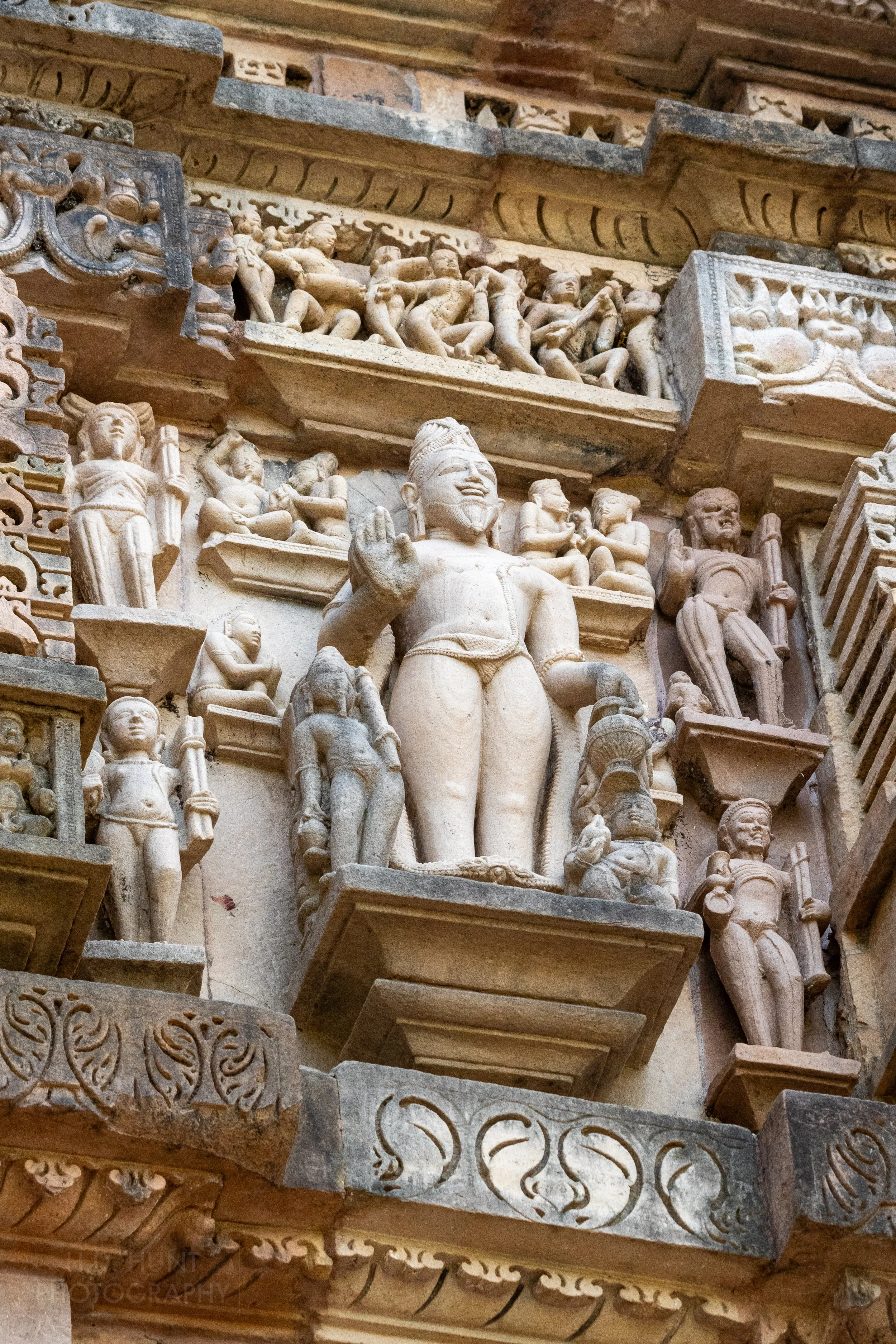 Close-up of the stone carvings adoring the Lakshmana Temple, Khajuraho Group of Monuments, India.