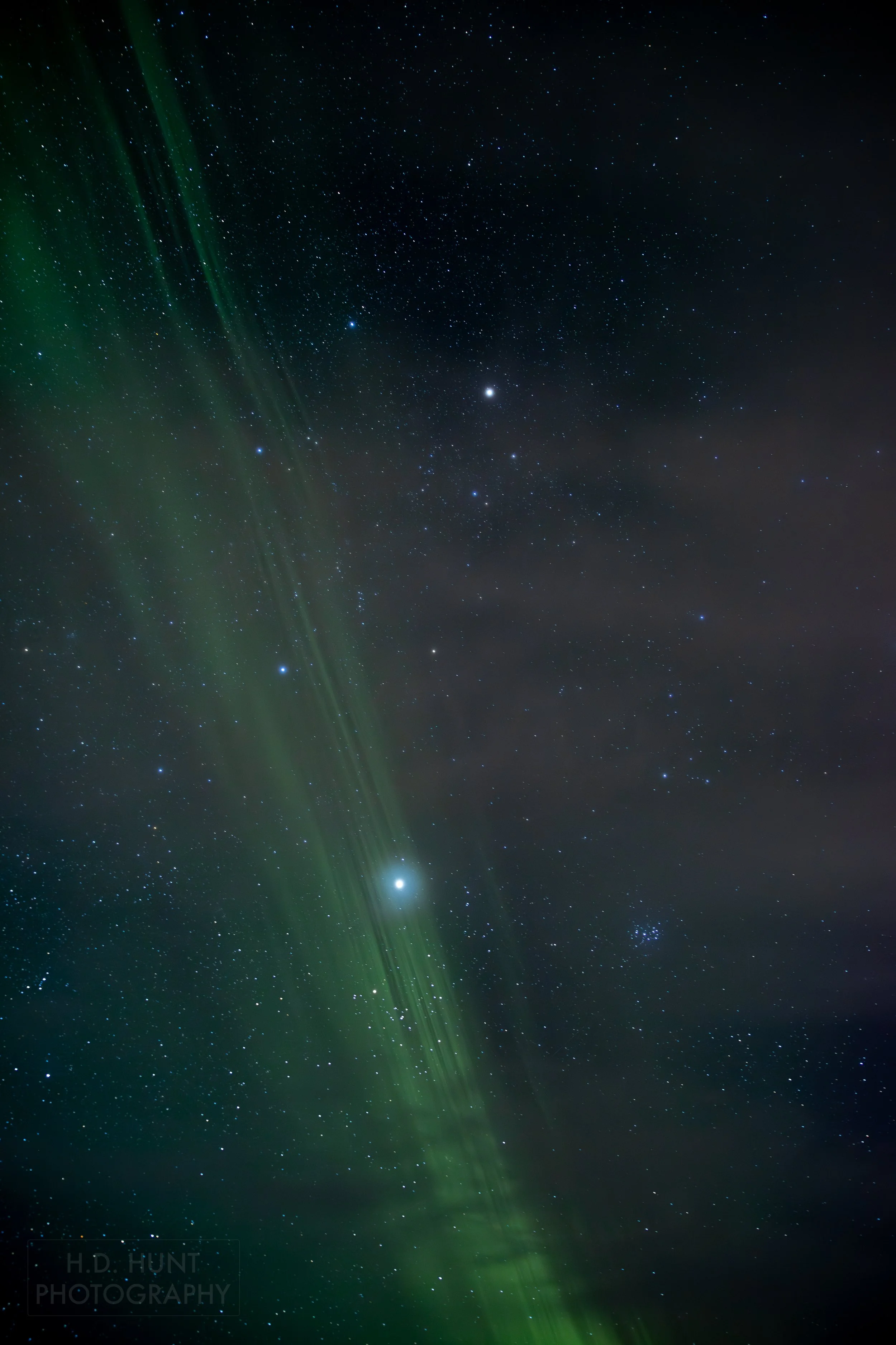 The green light of Aurora Borealis - the Northern Lights - is seen north of Grindavik on the Reykjanes Peninsula, Iceland.