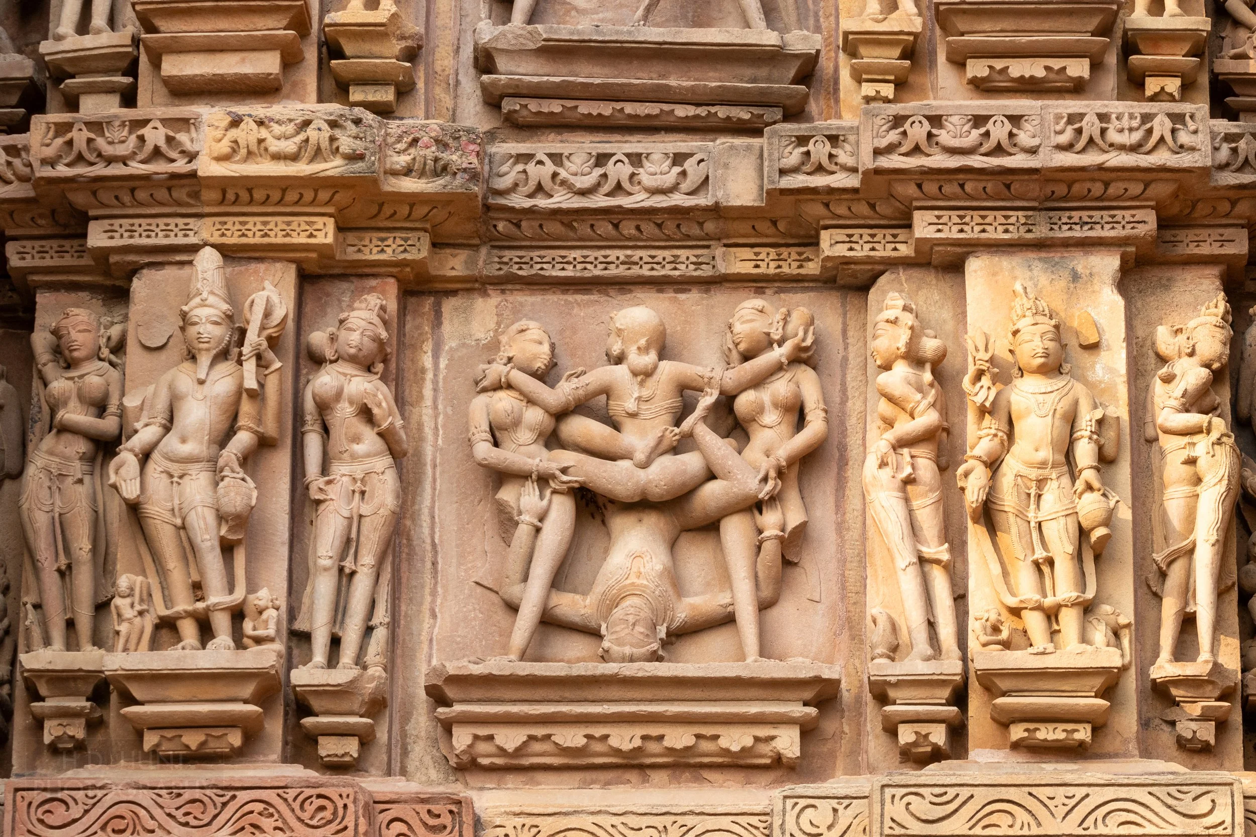 Close-up of the stone carvings adoring Kandariya Mahadeva, Khajuraho Group of Monuments, India.