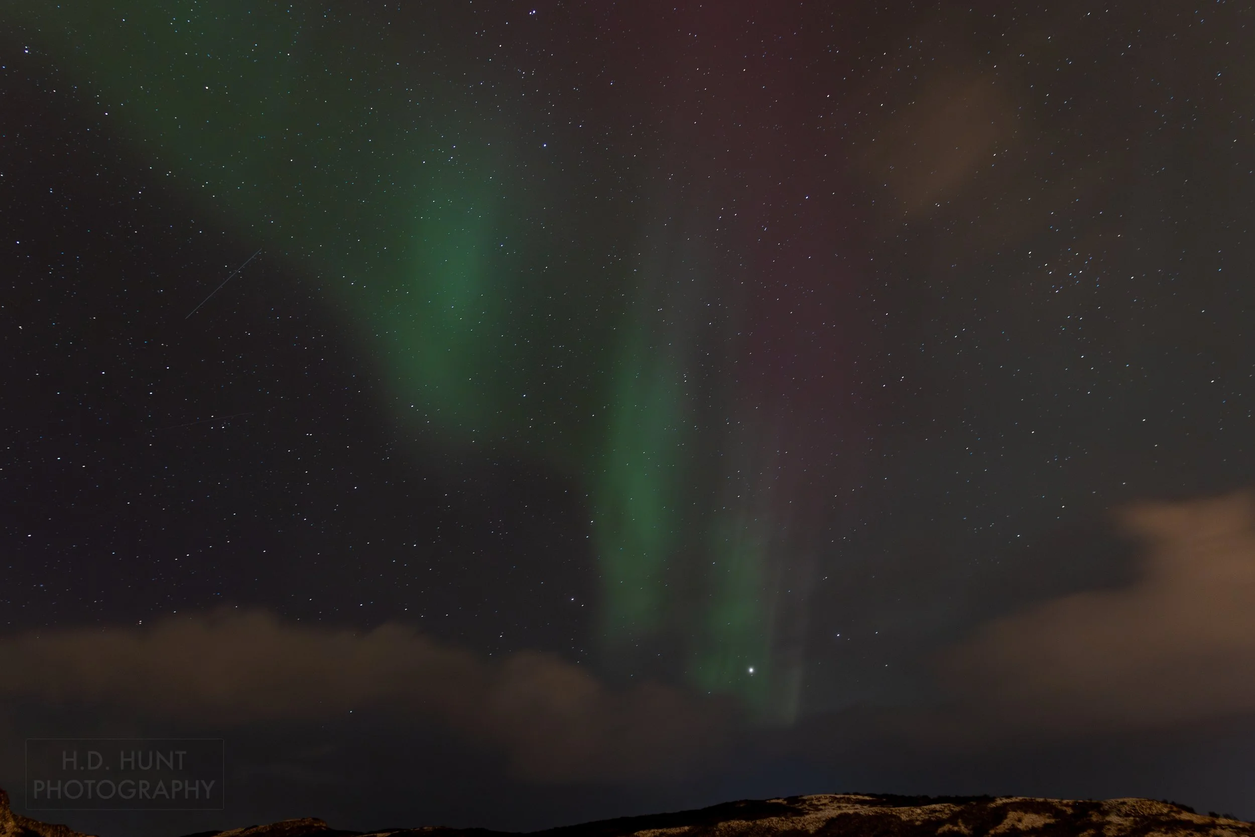 The green light of Aurora Borealis - the Northern Lights - is seen north of Reykholt í Biskupstungum, Iceland.