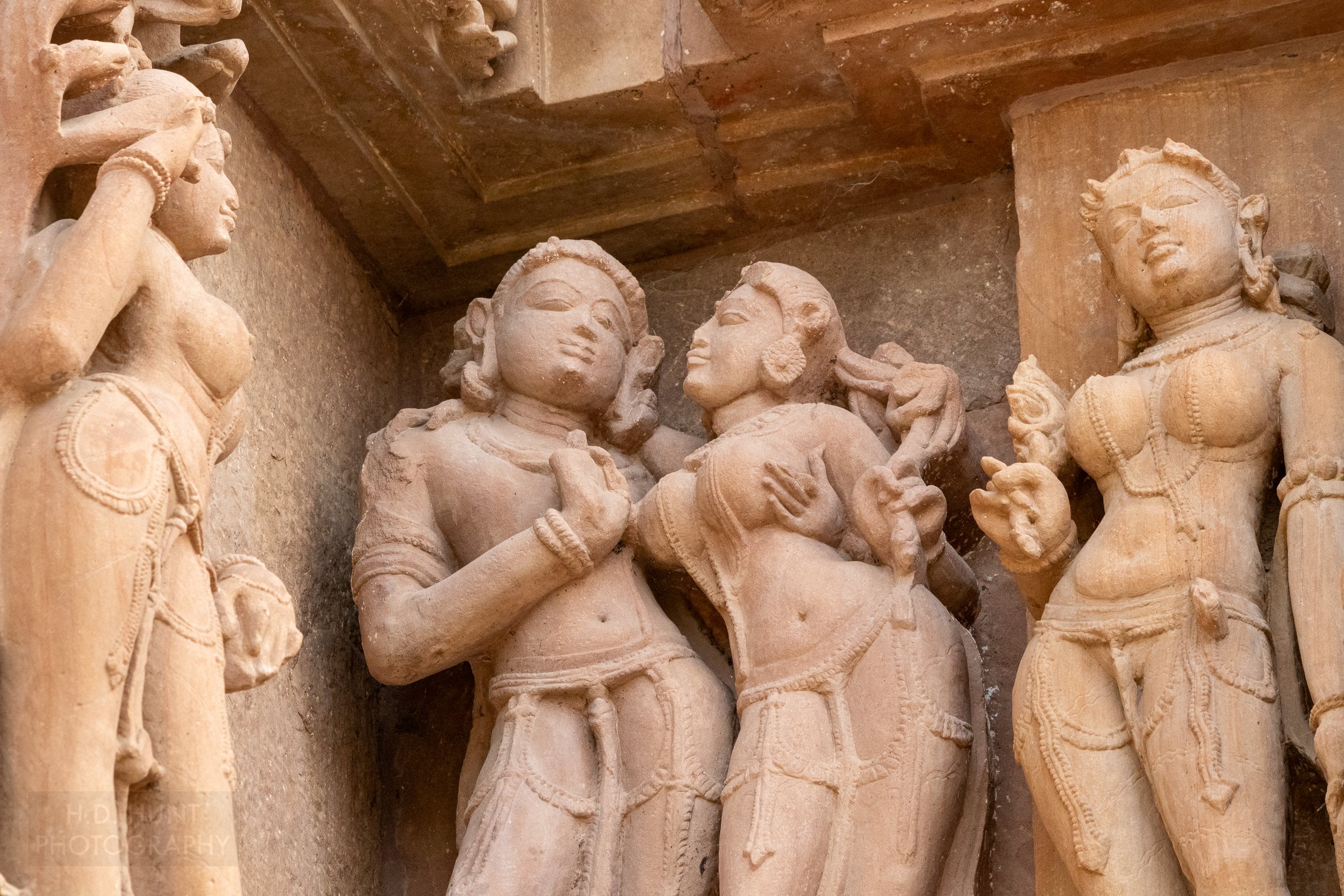 Close-up of the stone carvings adoring the Lakshmana Temple, Khajuraho Group of Monuments, India.