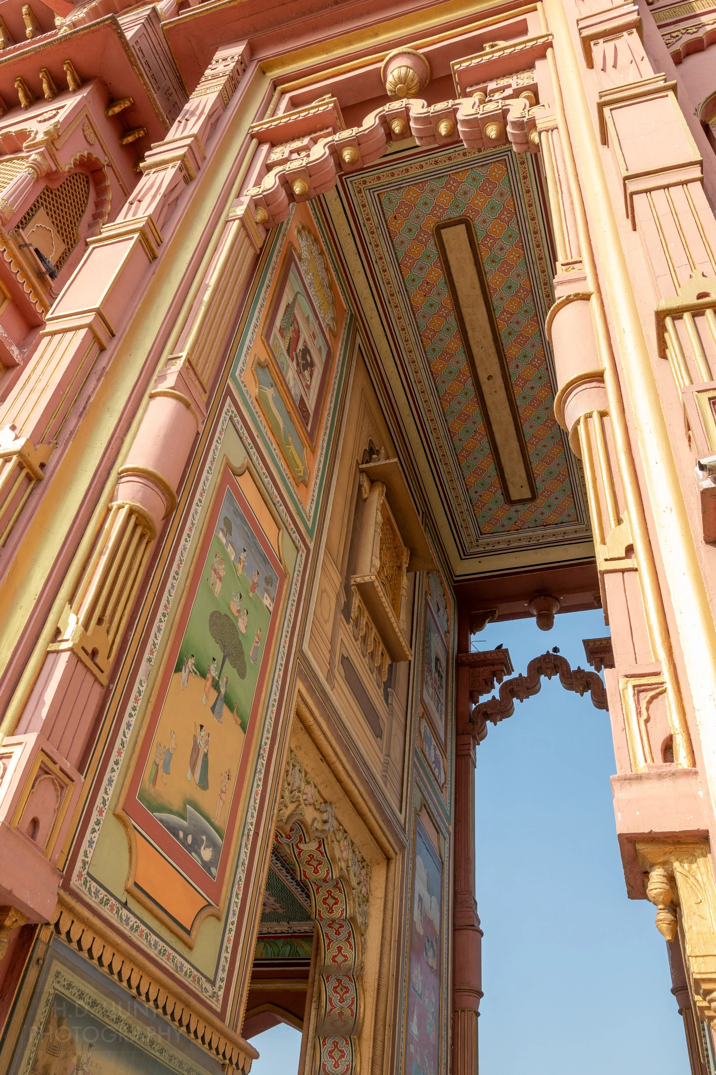Bright colored painted panels fill an archway at the Patrika Gate, Jaipur, India.