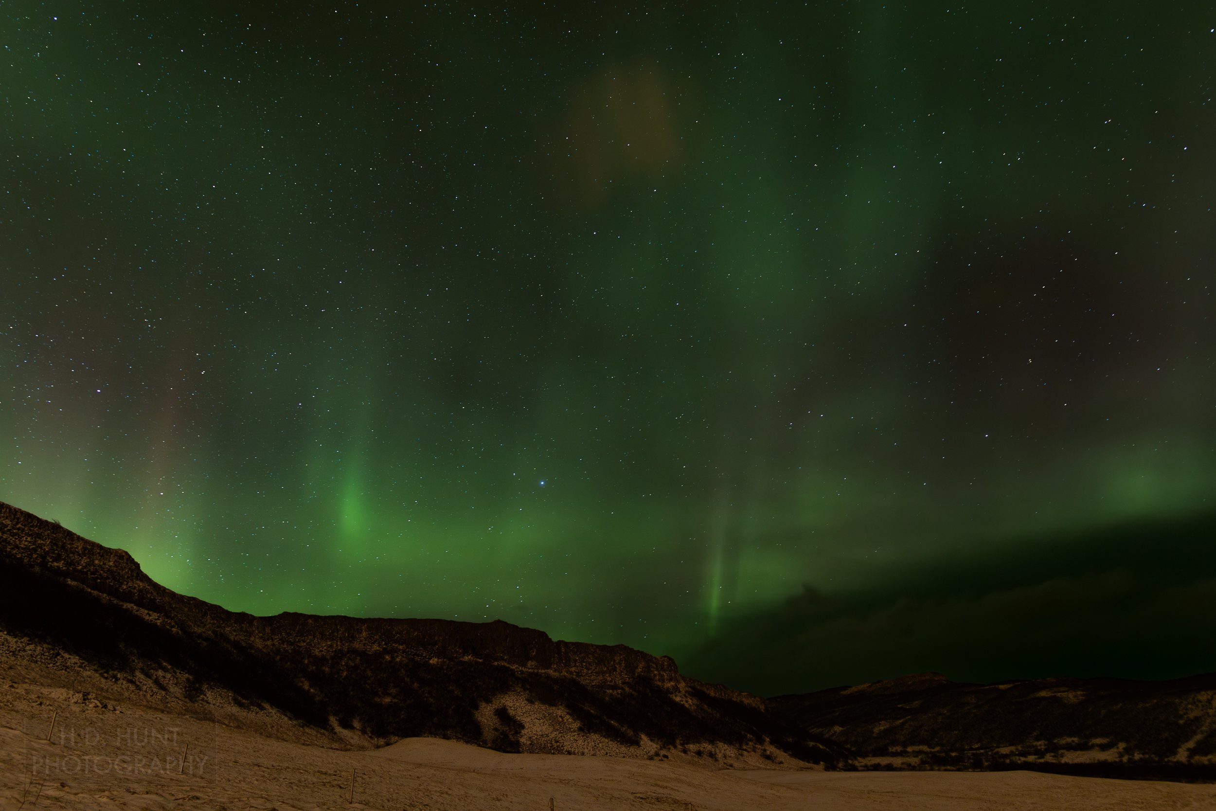 The green light of Aurora Borealis - the Northern Lights - is seen north of Reykholt í Biskupstungum, Iceland.