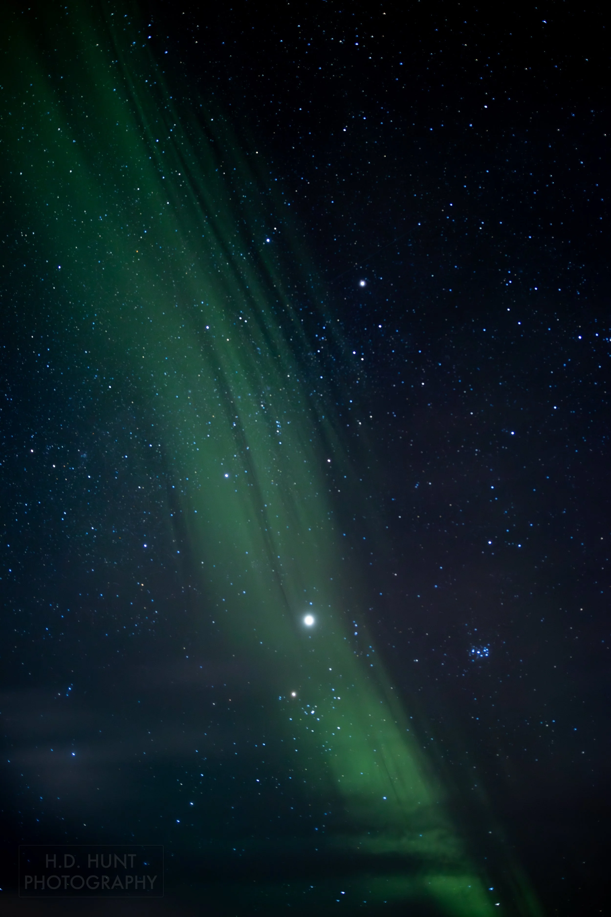 The green light of Aurora Borealis - the Northern Lights - is seen north of Grindavik on the Reykjanes Peninsula, Iceland.