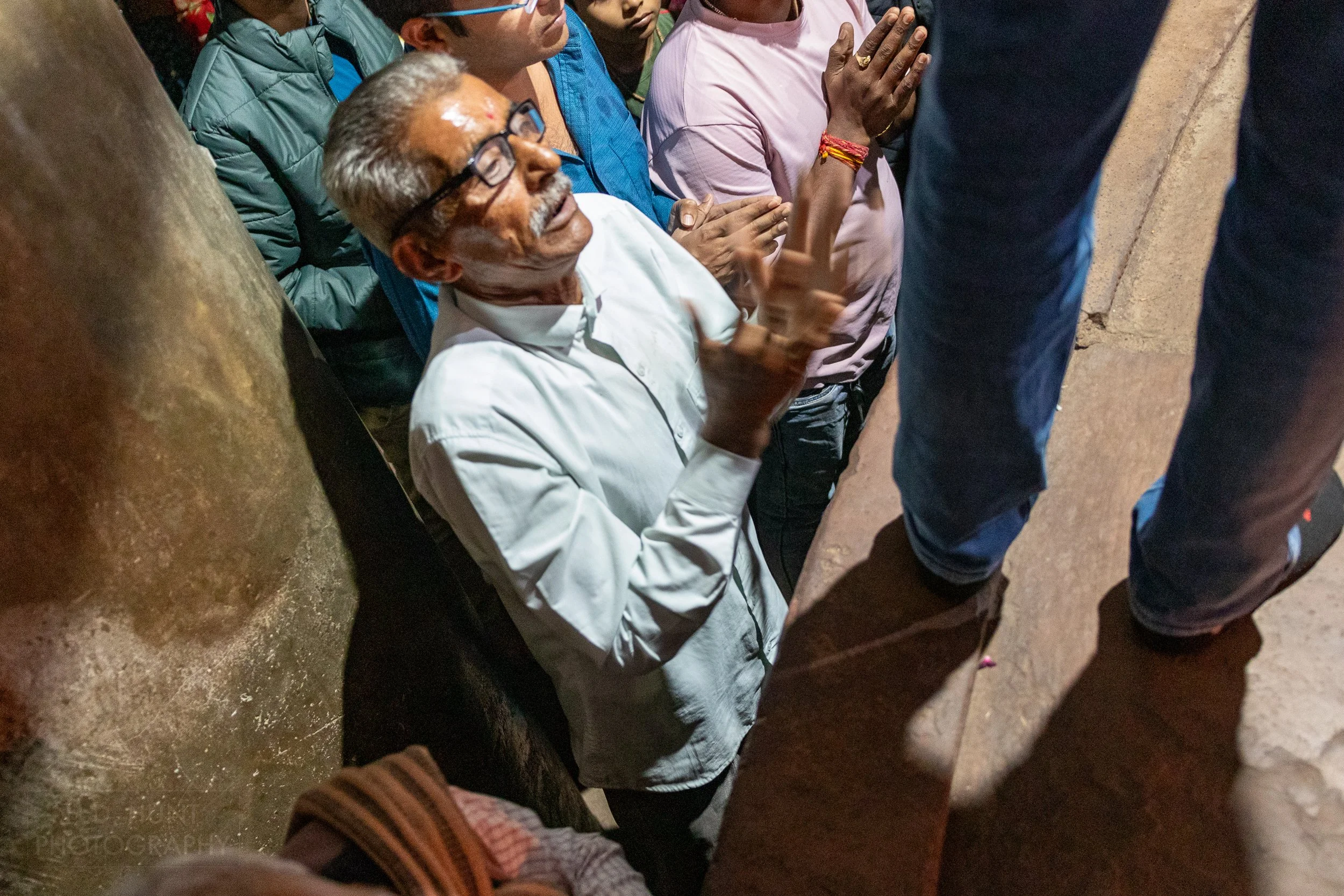 Parishioners participate in a religious ceremony in the stone Matangeshvara Temple, Khajuraho, India.
